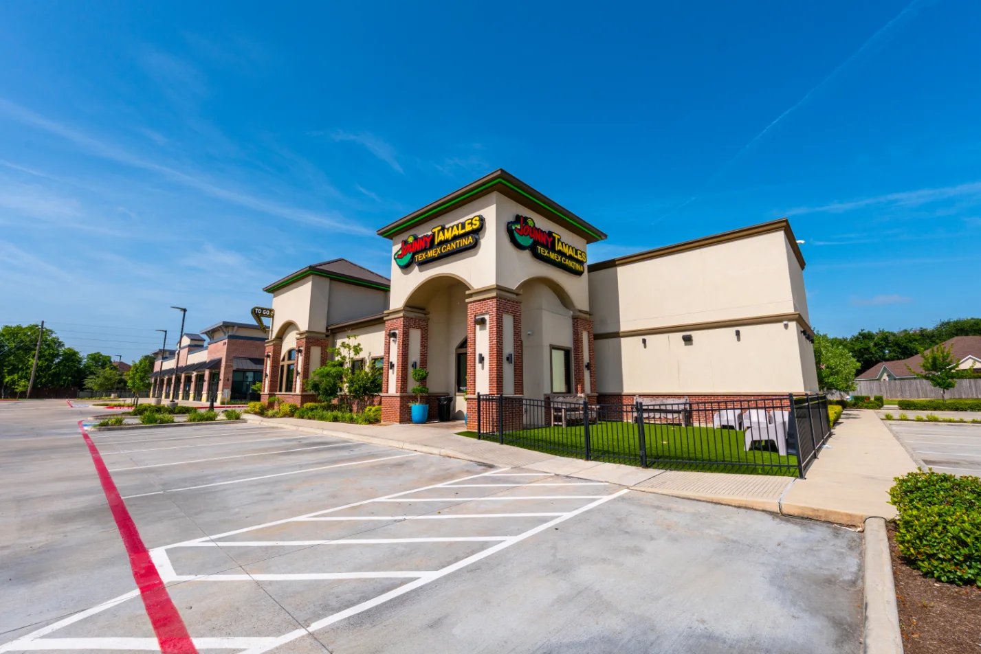 Exterior view of a Tex-Mex restaurant with vibrant signage