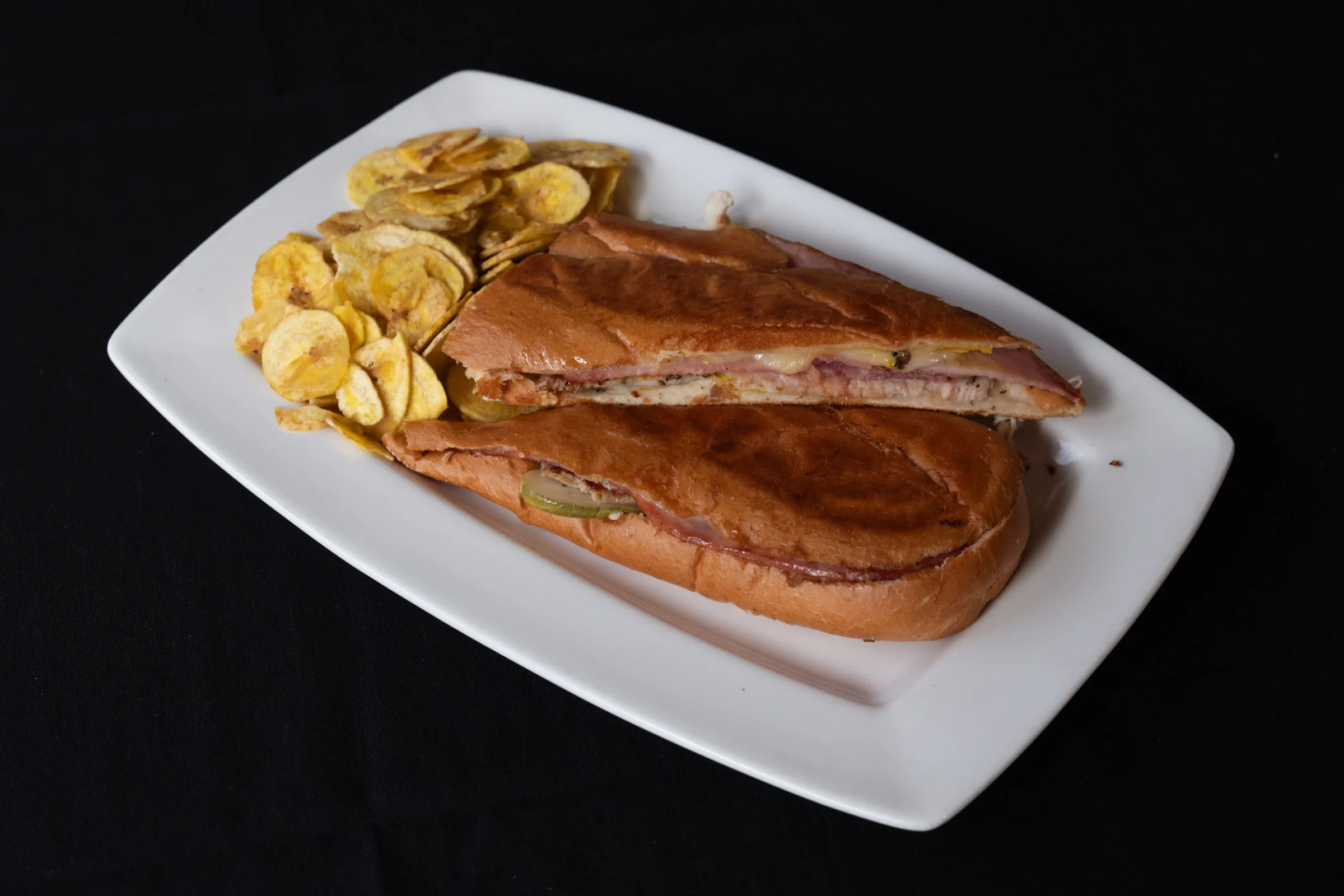 Cuban sandwich served with plantain chips