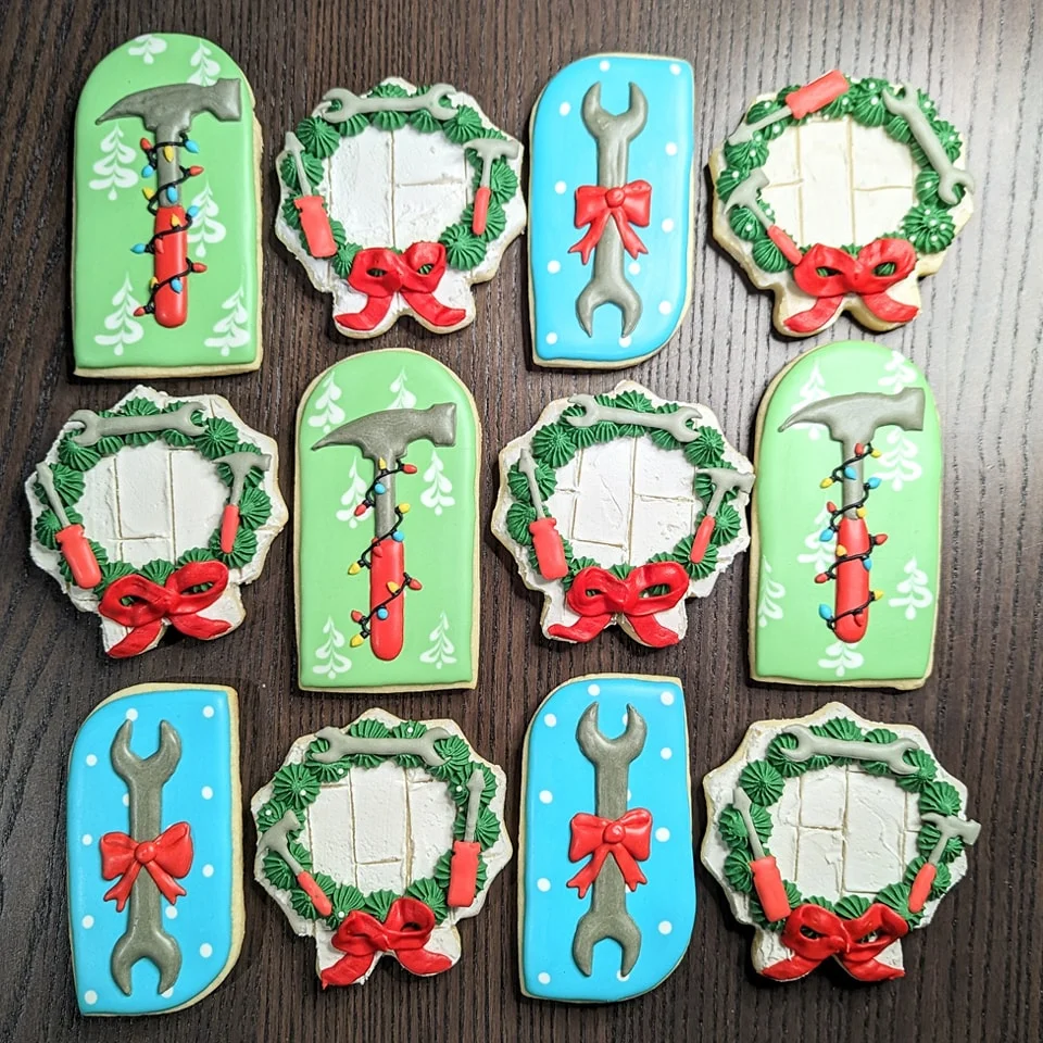 Decorative holiday cookies shaped like tools and wreaths