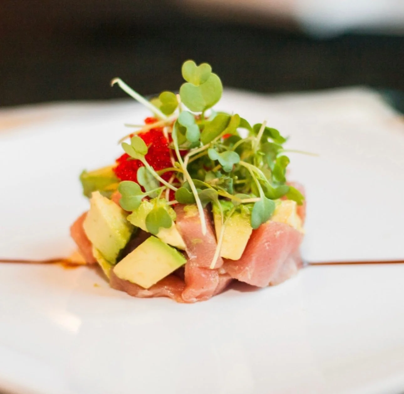 Japanese tuna tartare with avocado and microgreens