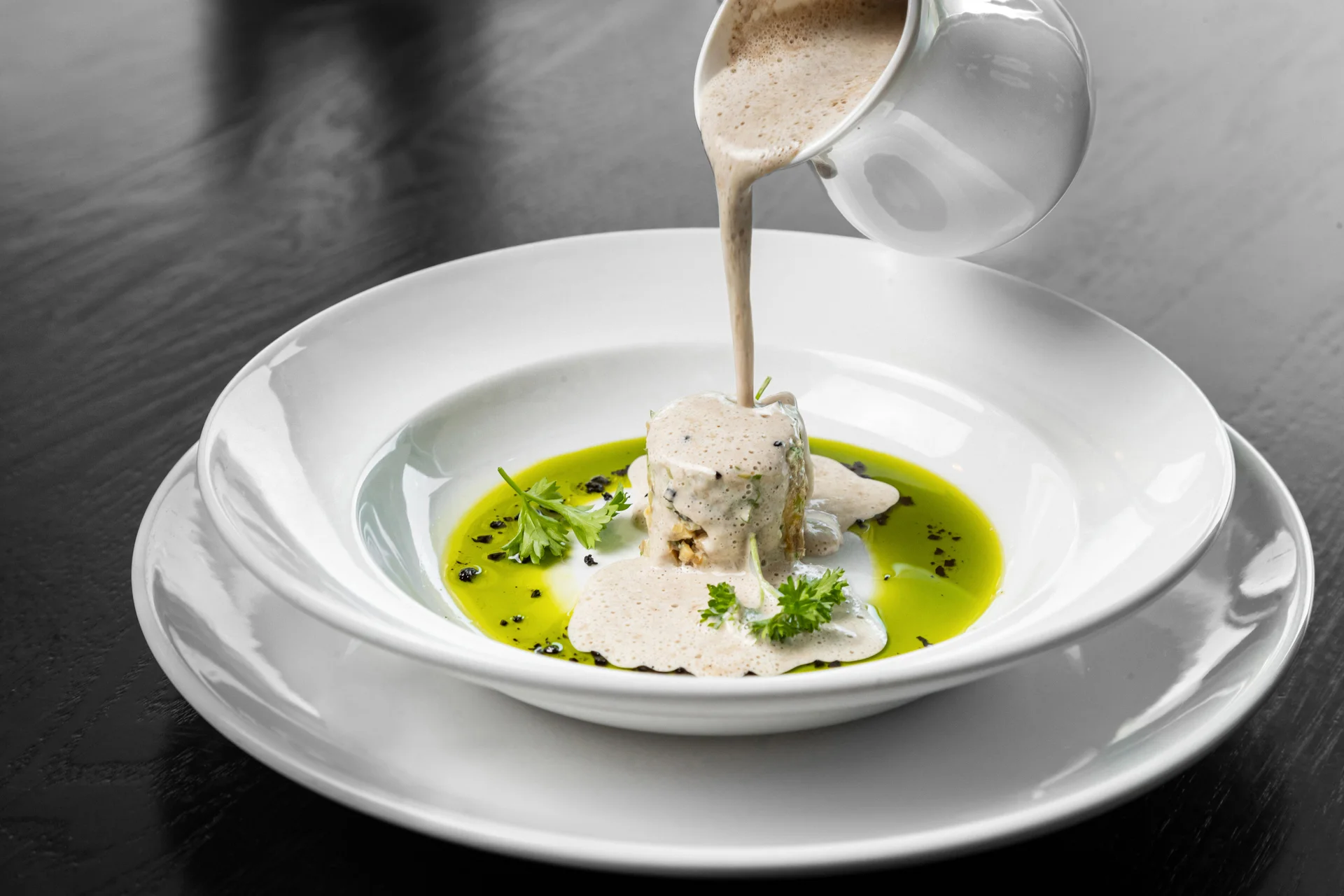 Elegant dish of French terrine with creamy sauce and herbs