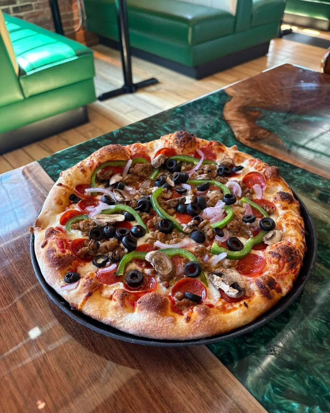 Loaded meat lover's pizza with pepperoni and olives