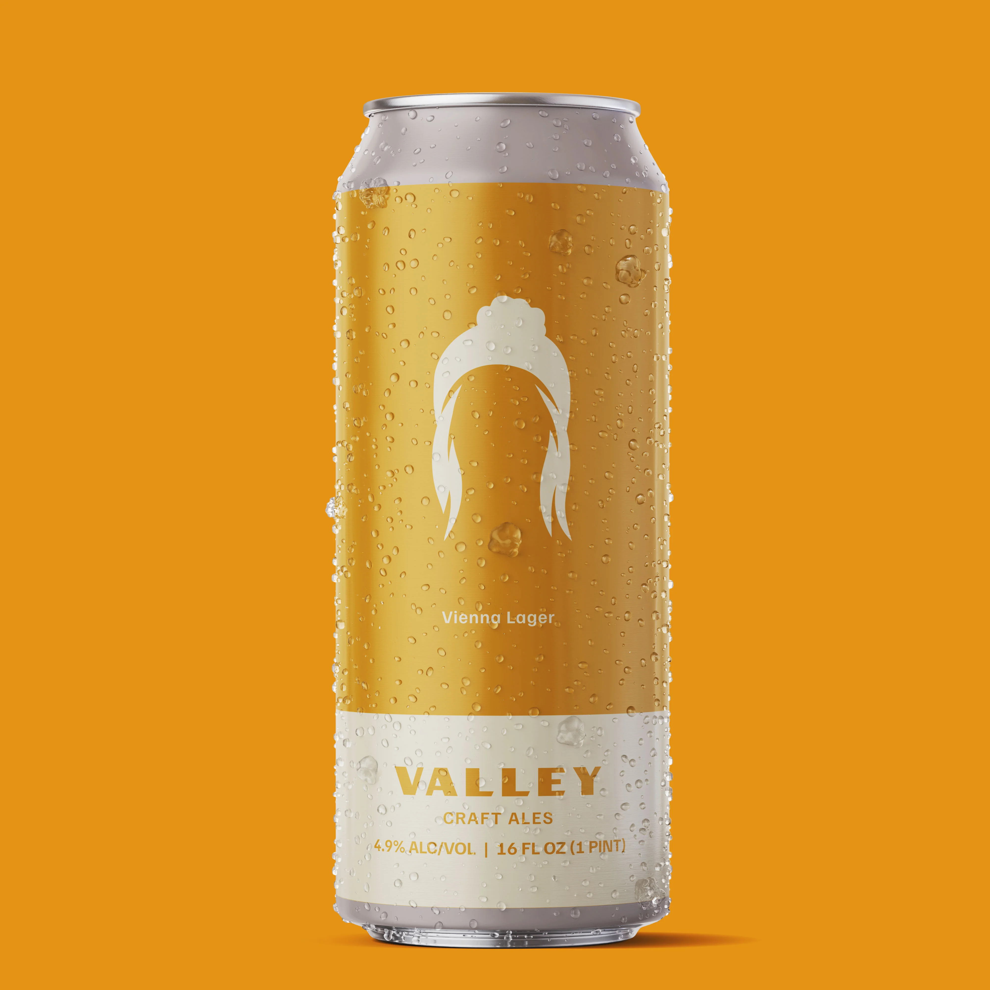 Can of Valley Vienn Lager with condensation on a vibrant orange background