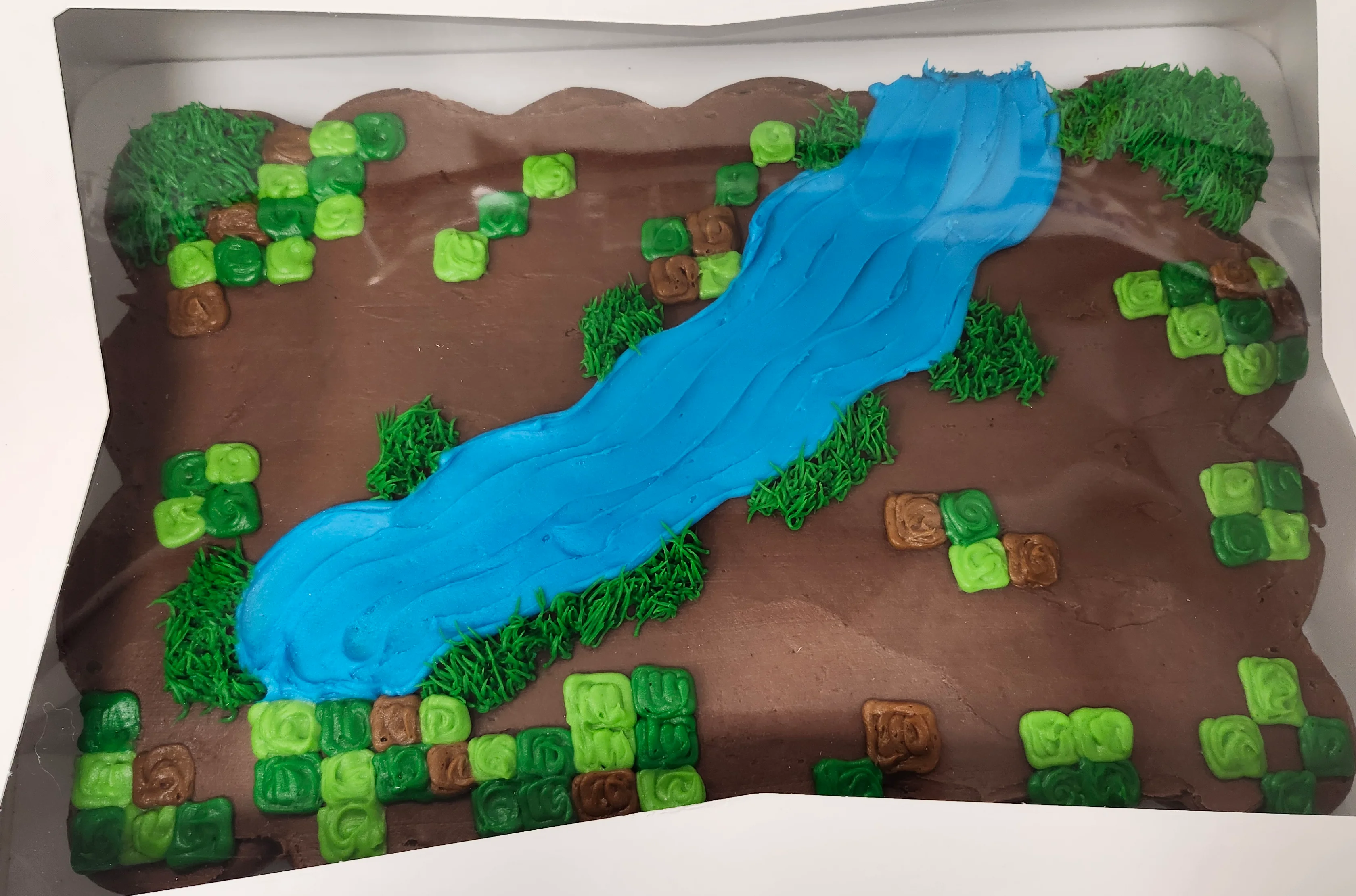 Cupcake pull apart decorated to look like Minecraft game scape [pixelated].