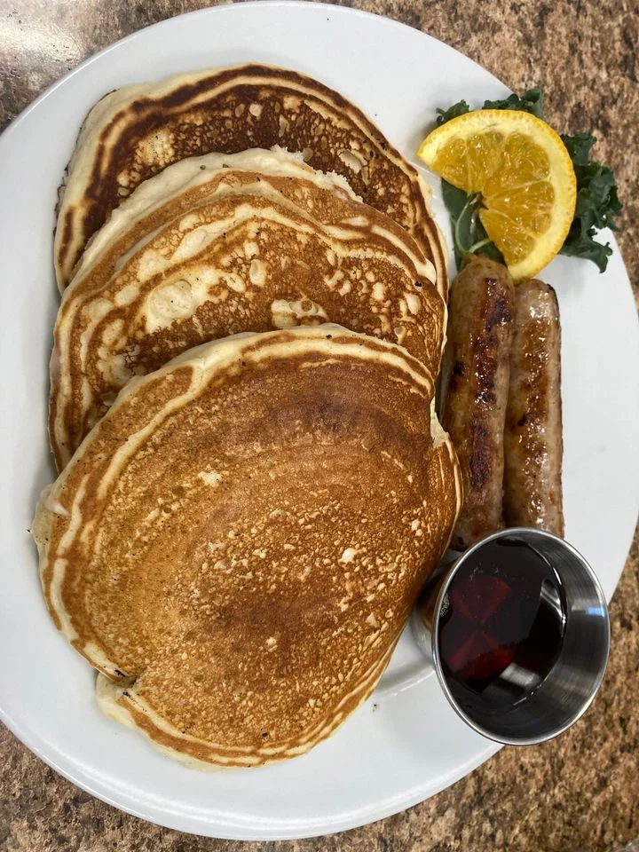 Fluffy buttermilk pancakes with sausage and syrup