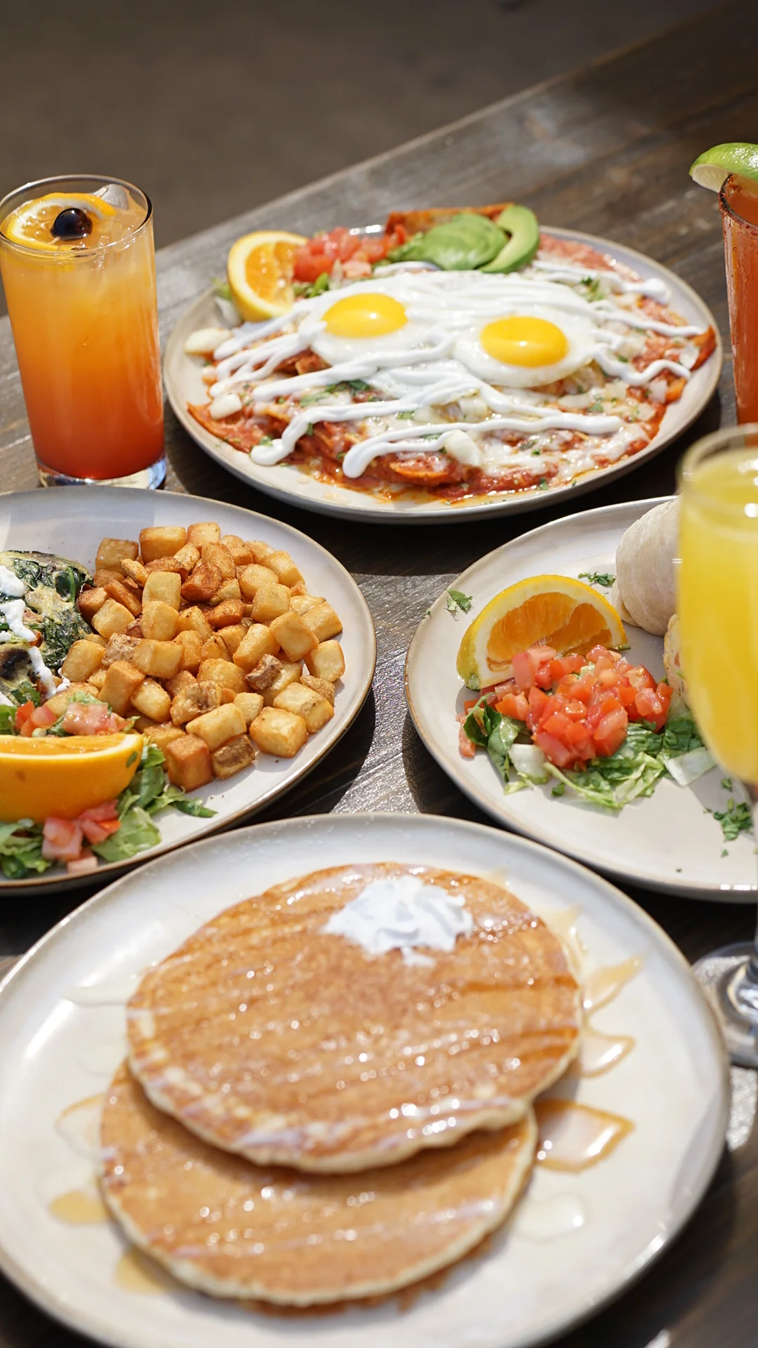 A plate of quesadillas featuring golden-brown tortillas filled with cheese and herbs, accompanied by a fresh salad and dipping sauces.