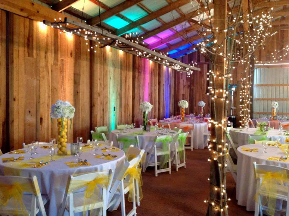 Elegant rustic event space with colorful decor and tables