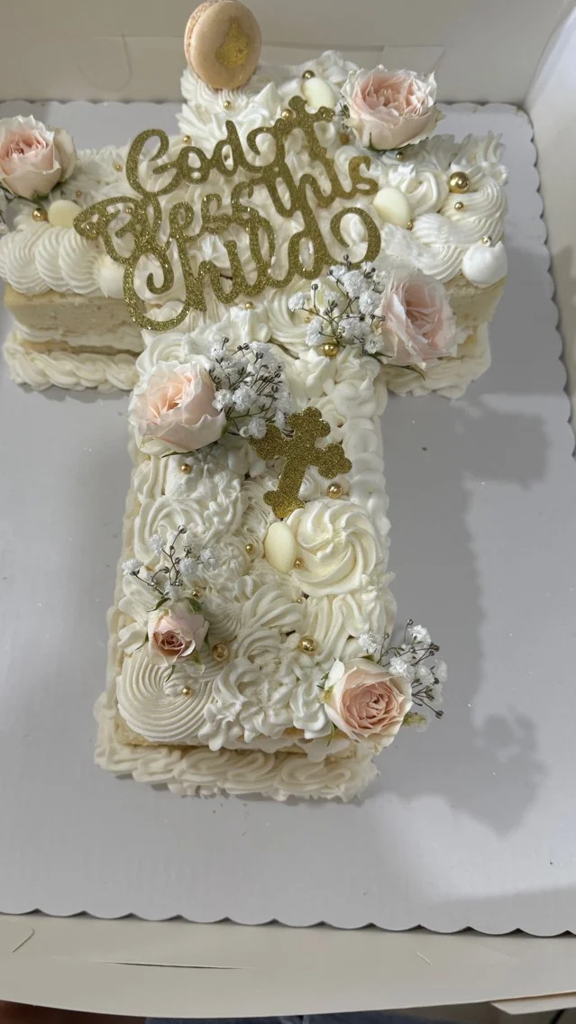 Decorative cross-shaped cake for a religious celebration