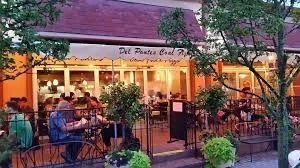Charming restaurant exterior with outdoor seating and warm ambiance