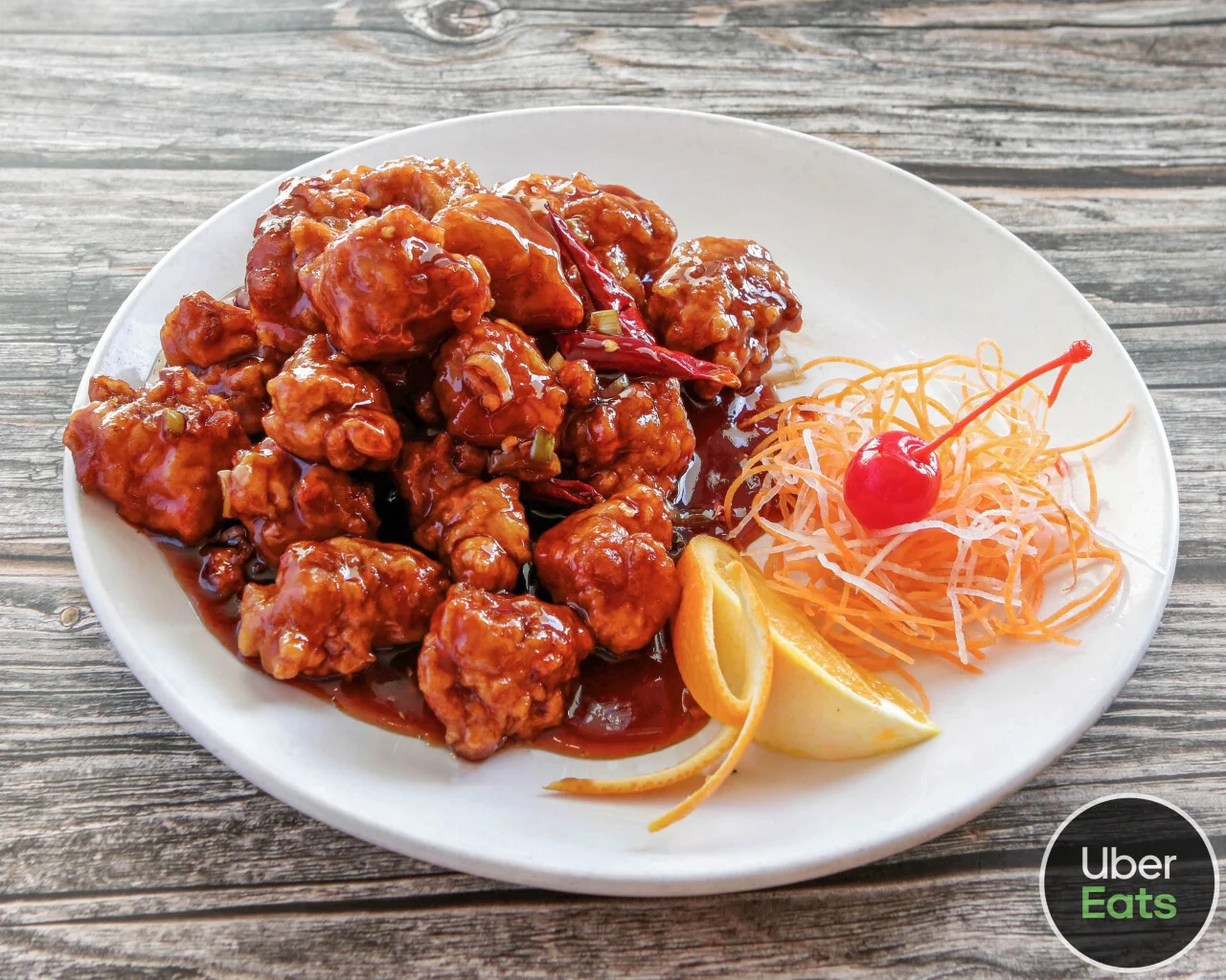 Sweet and sour chicken served with garnishes