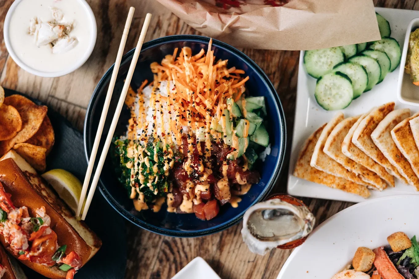 Hawaiian poke bowl with tuna, rice, cucumber, carrots, and sesame