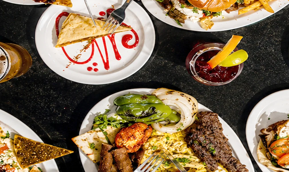 Assorted Mediterranean dishes with grilled meats and fresh sides