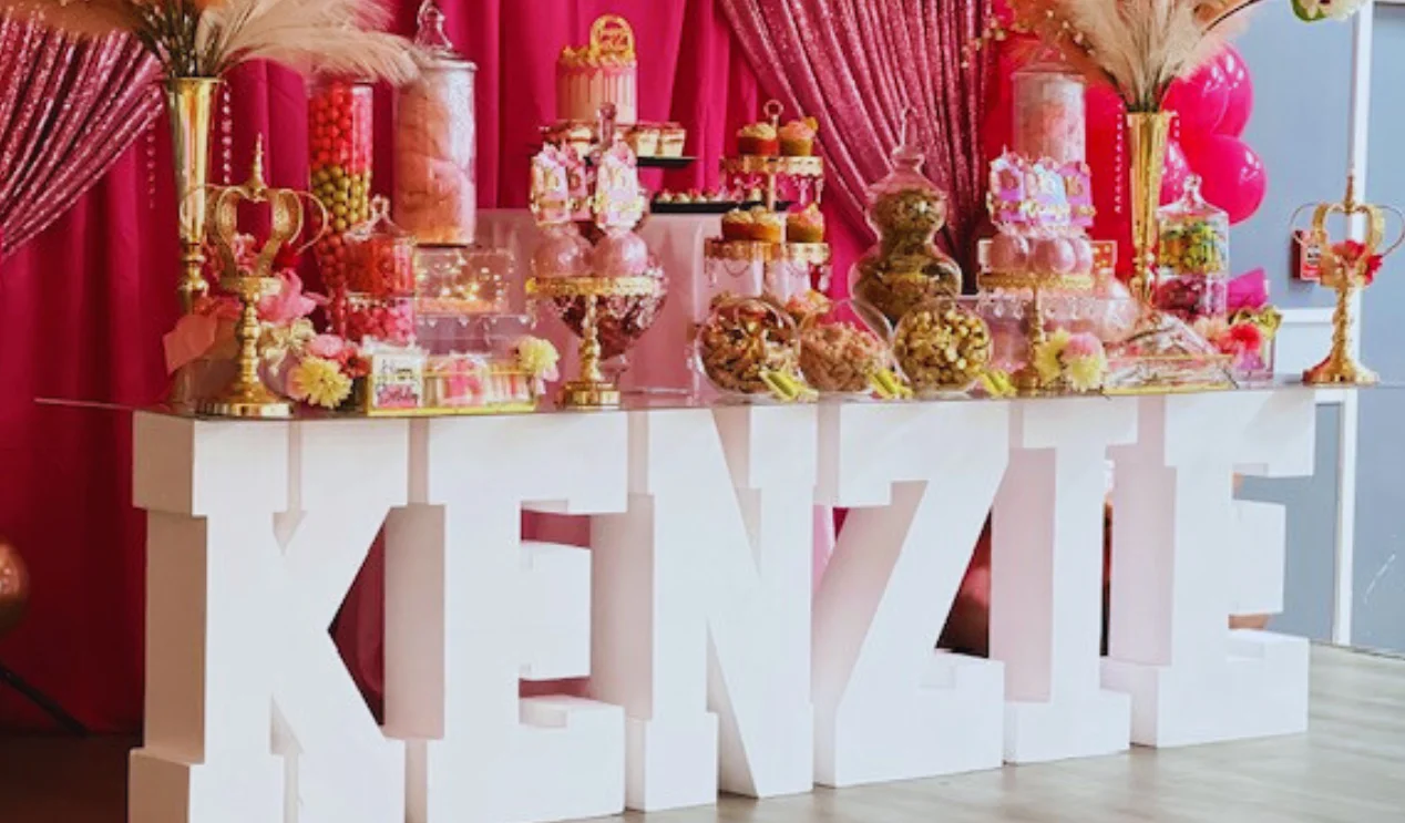 Colorful dessert table for a celebration with sweets and decorations