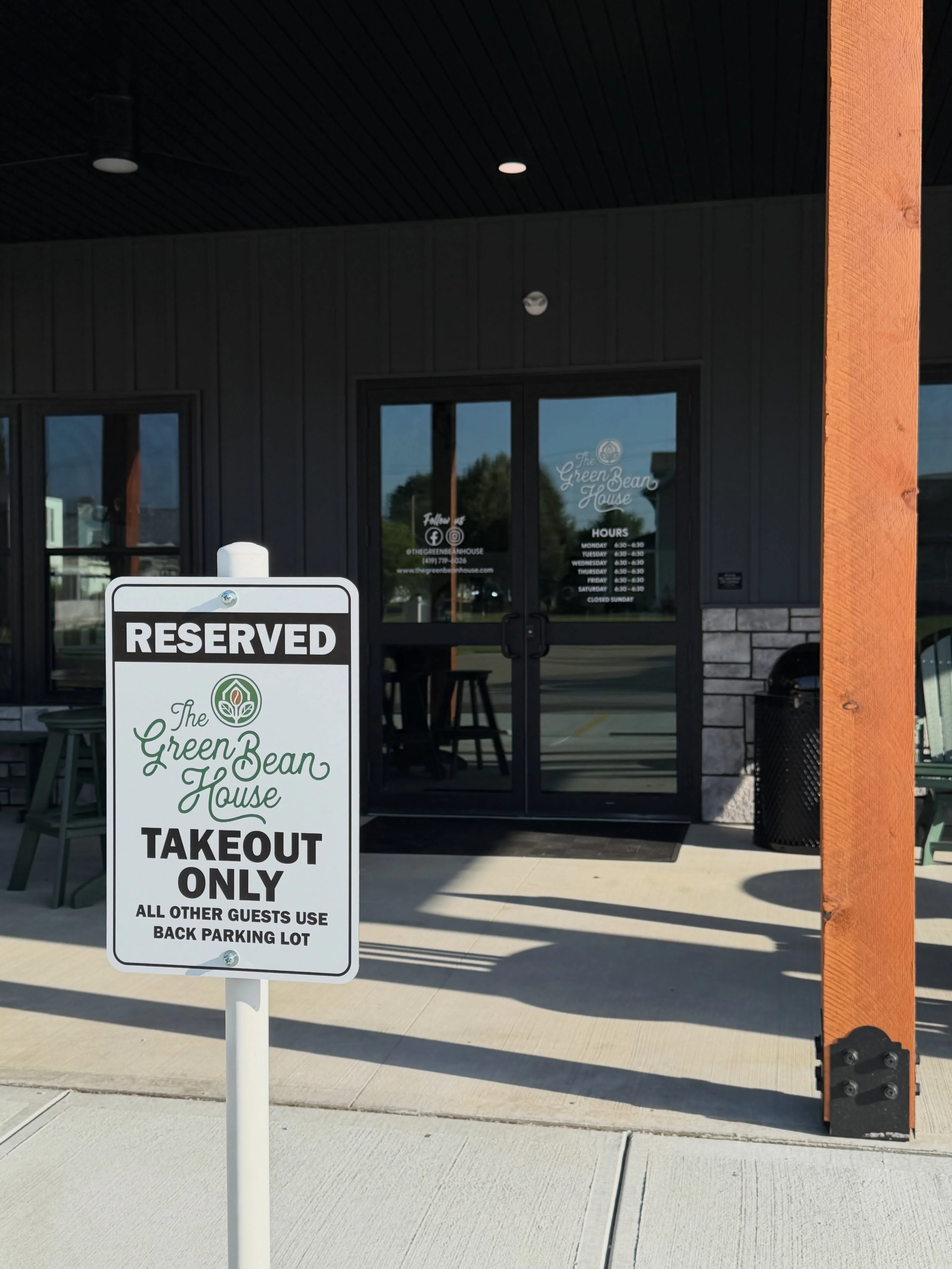 Reserved sign for takeout at The Green Bean House restaurant entrance
