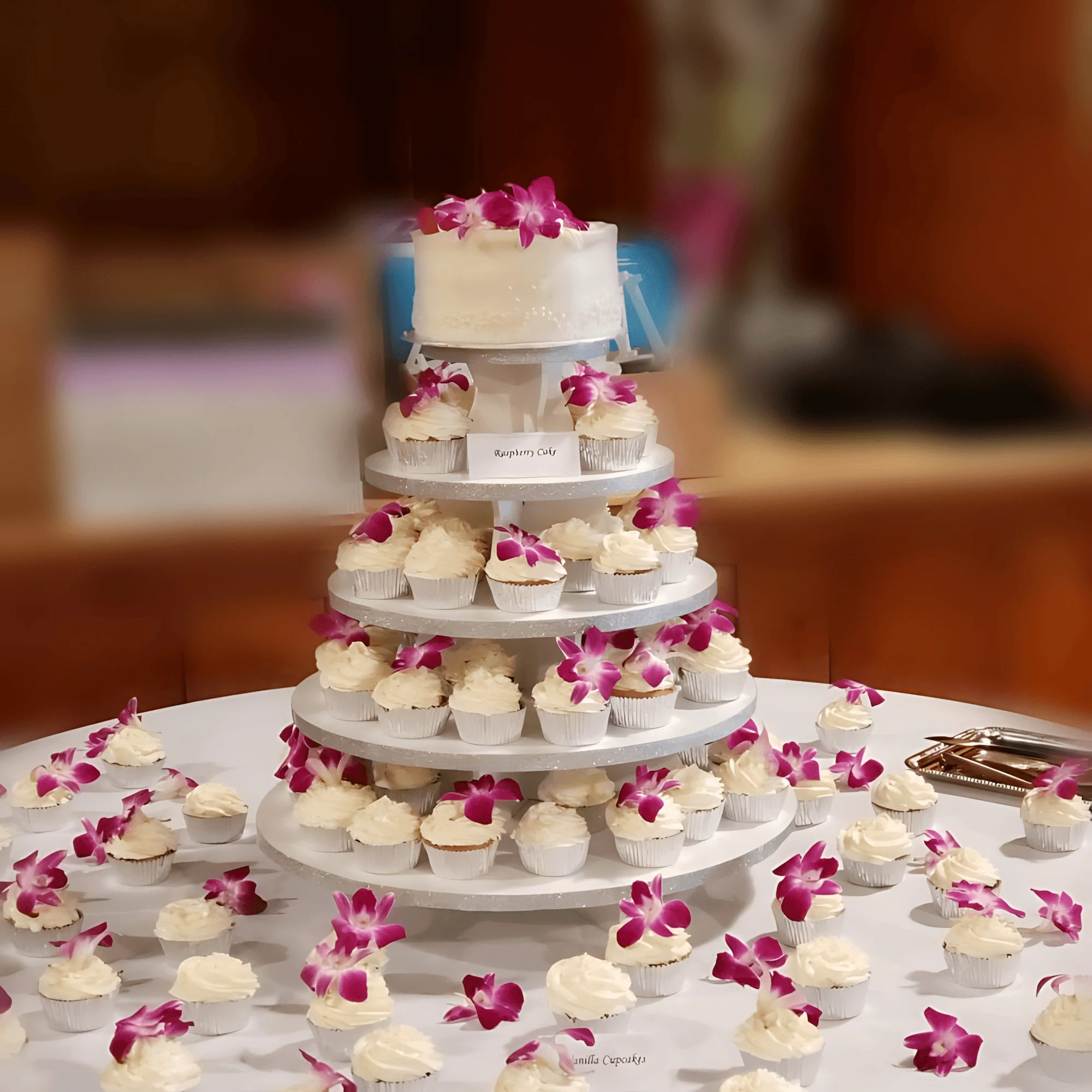 Elegant cupcake tower with floral decorations for a celebration