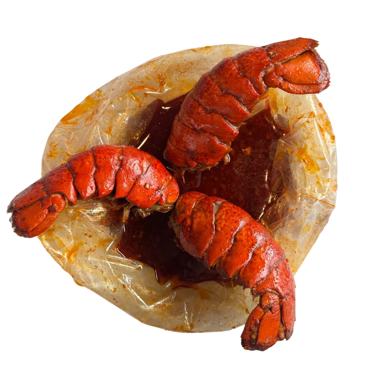 Cajun-style boiled lobster tails in spicy sauce