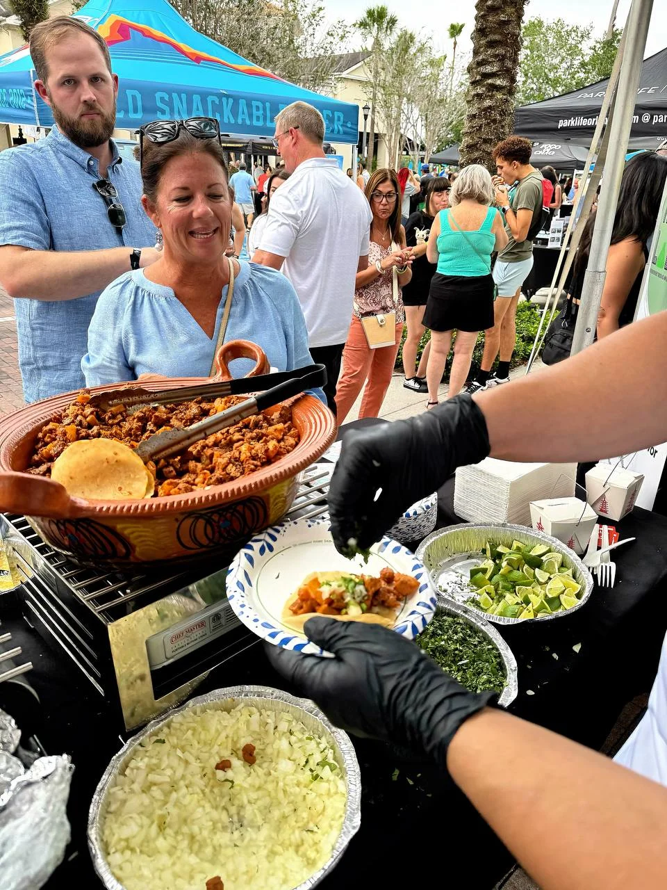Delicious street tacos being prepared at a food festival