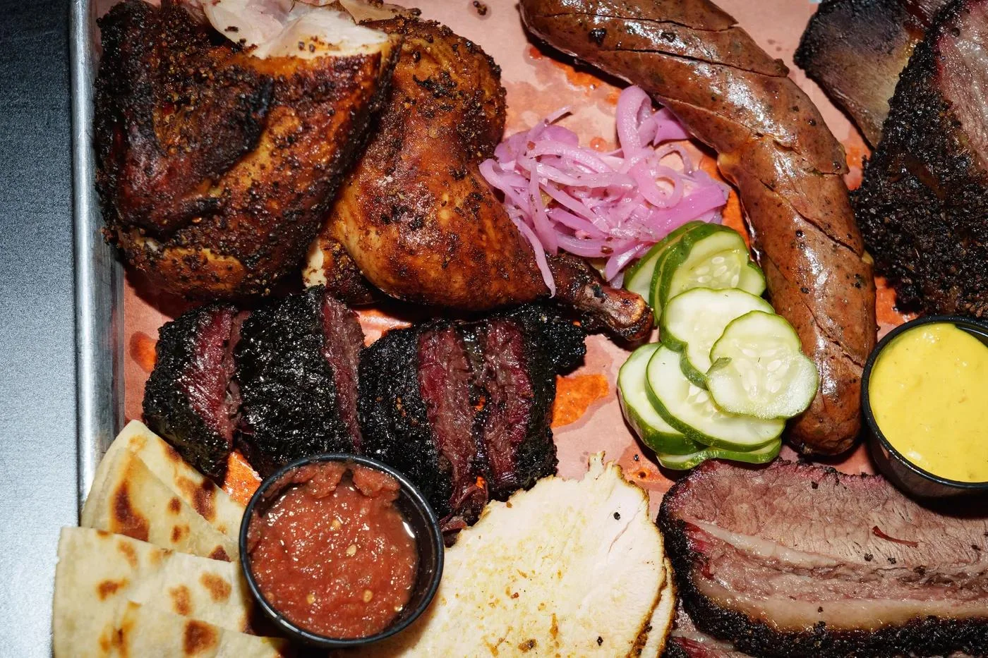 Assorted barbecue platter featuring smoked meats