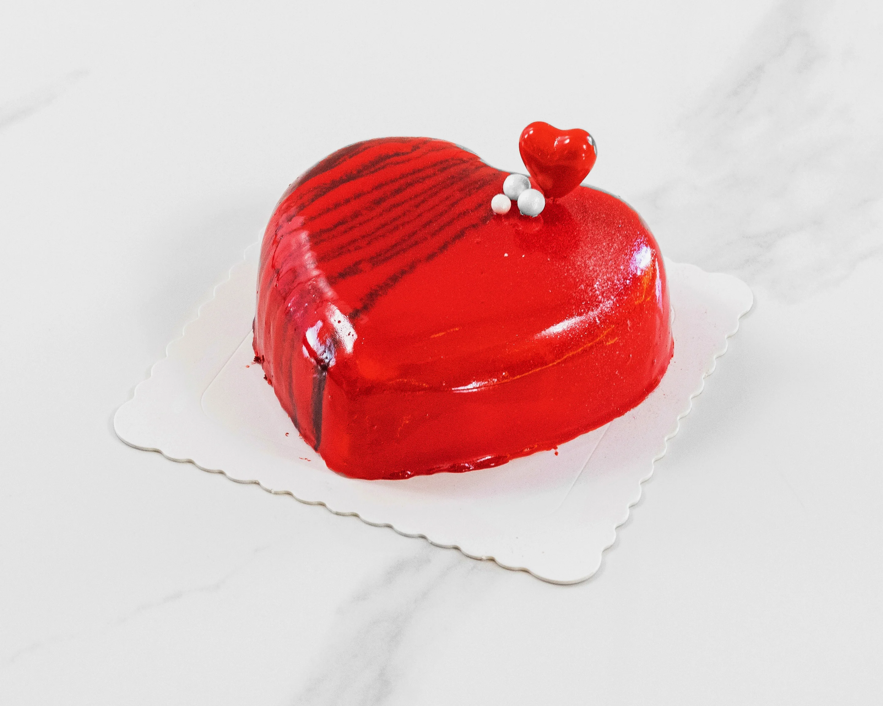 Heart-shaped red mousse cake for romantic occasions