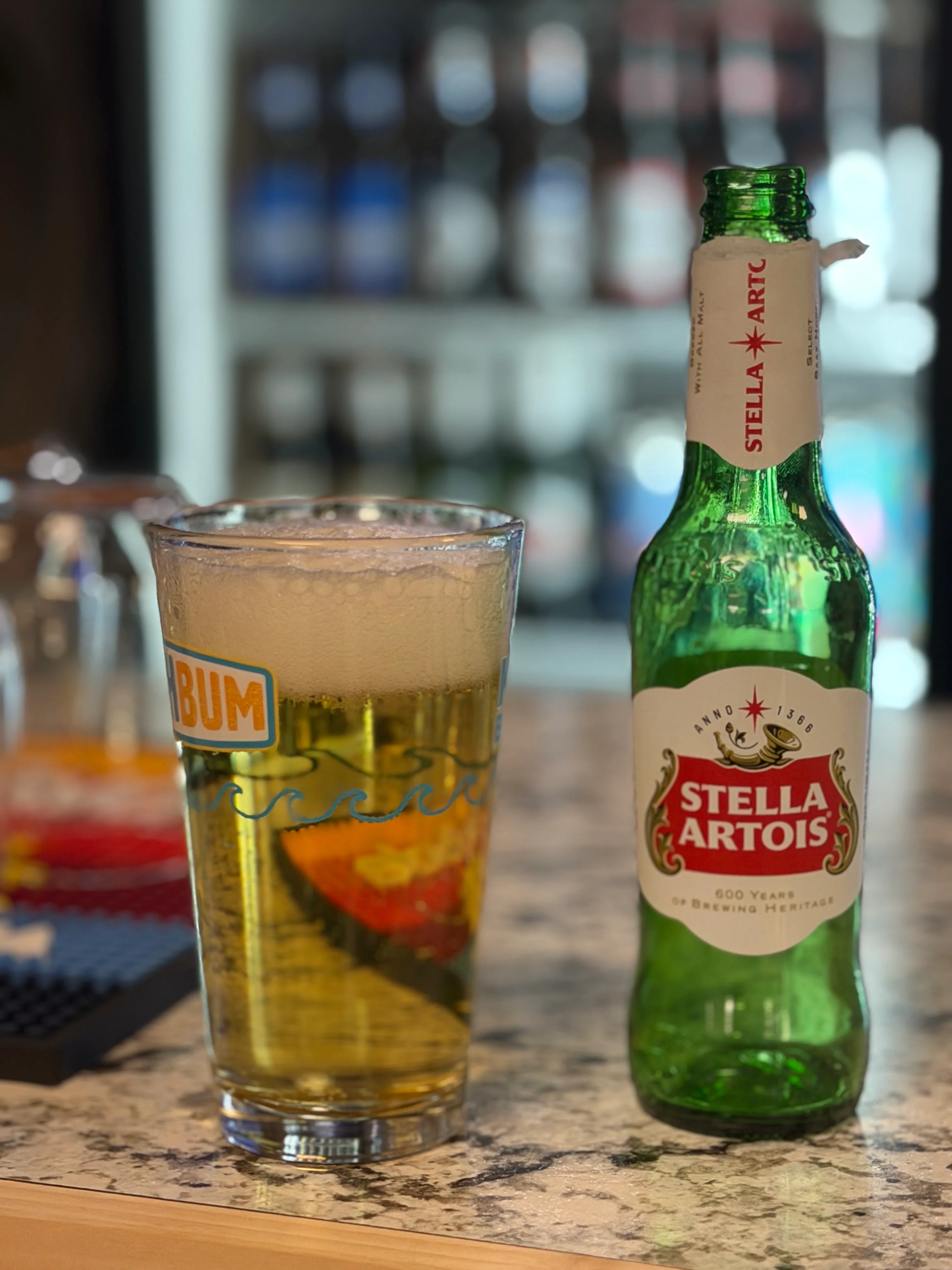 Chilled Stella Artois beer in a glass on a bar counter
