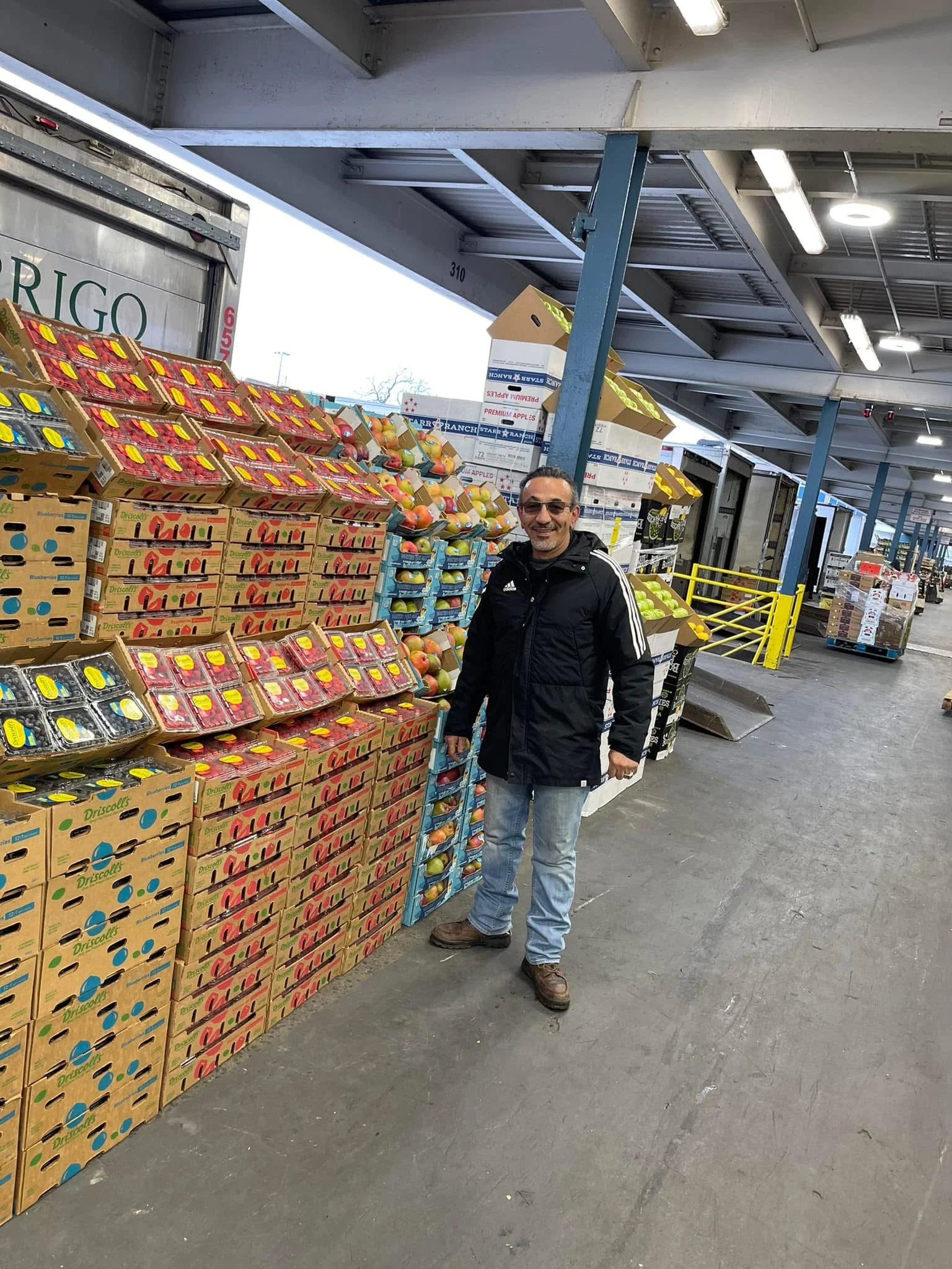 Fruit market with stacked boxes of fresh produce