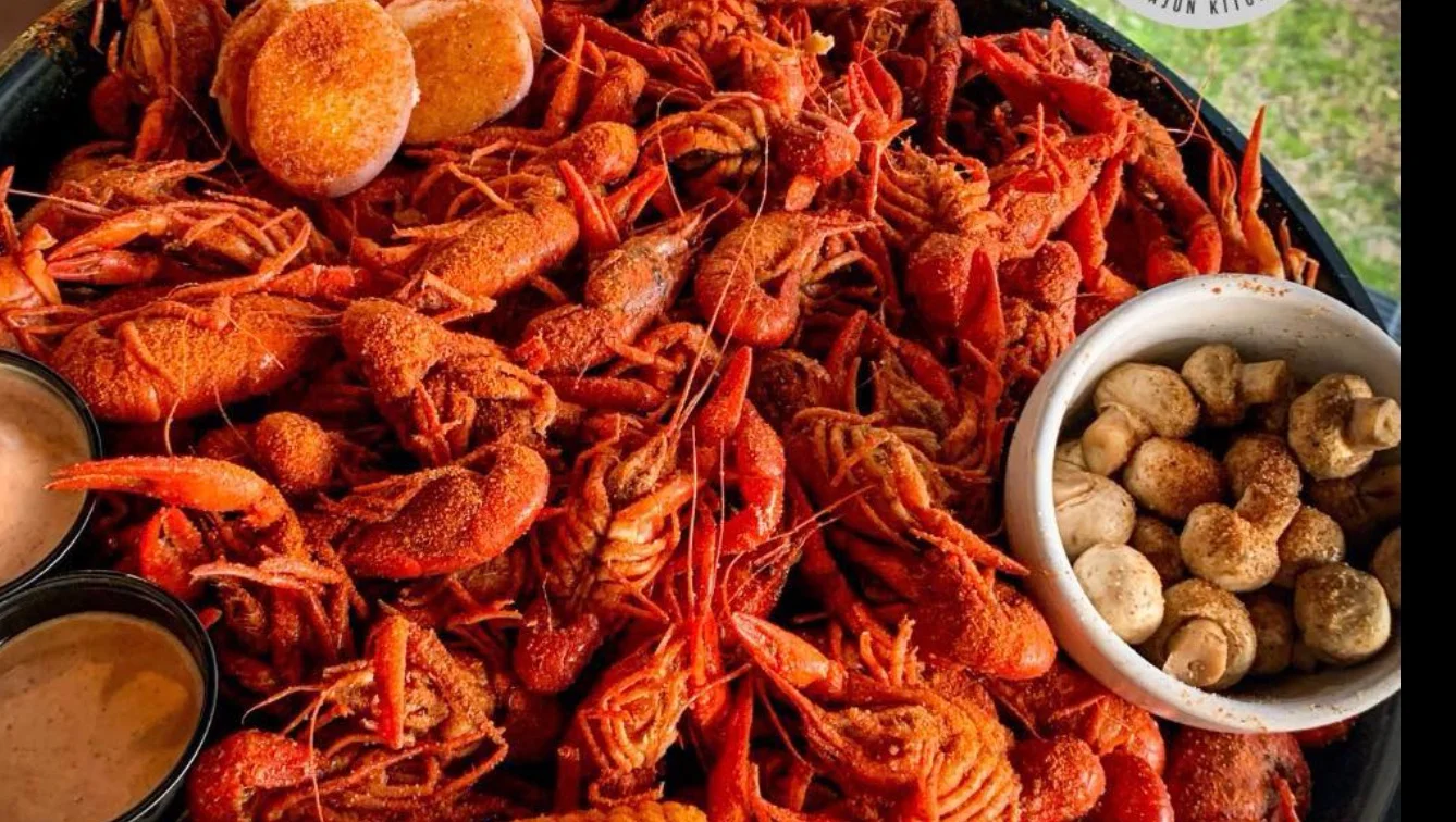 Spicy Cajun crawfish boil with dipping sauces
