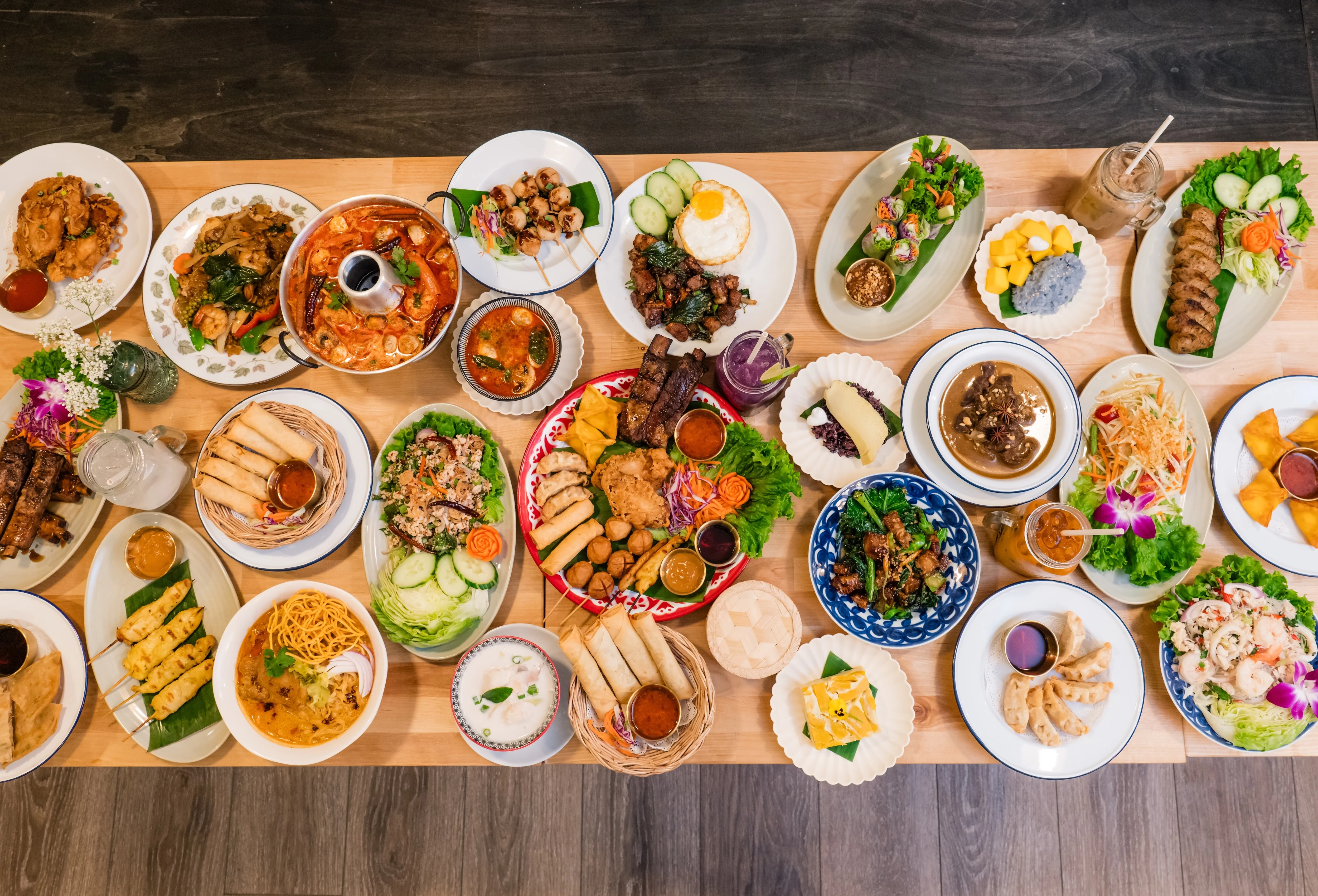 Assorted Southeast Asian dishes on a wooden table