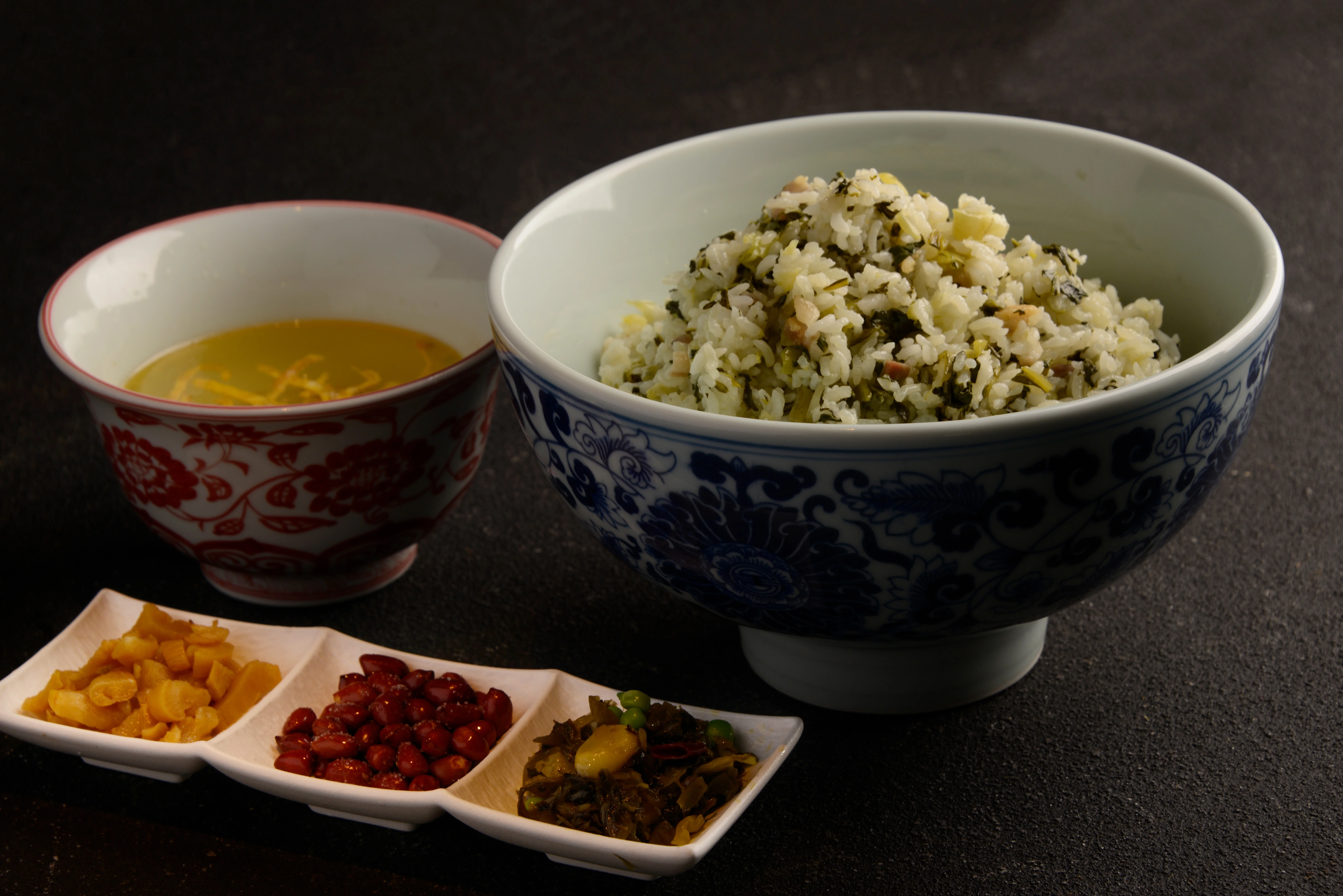 Bowl of Chinese fried rice with side condiments
