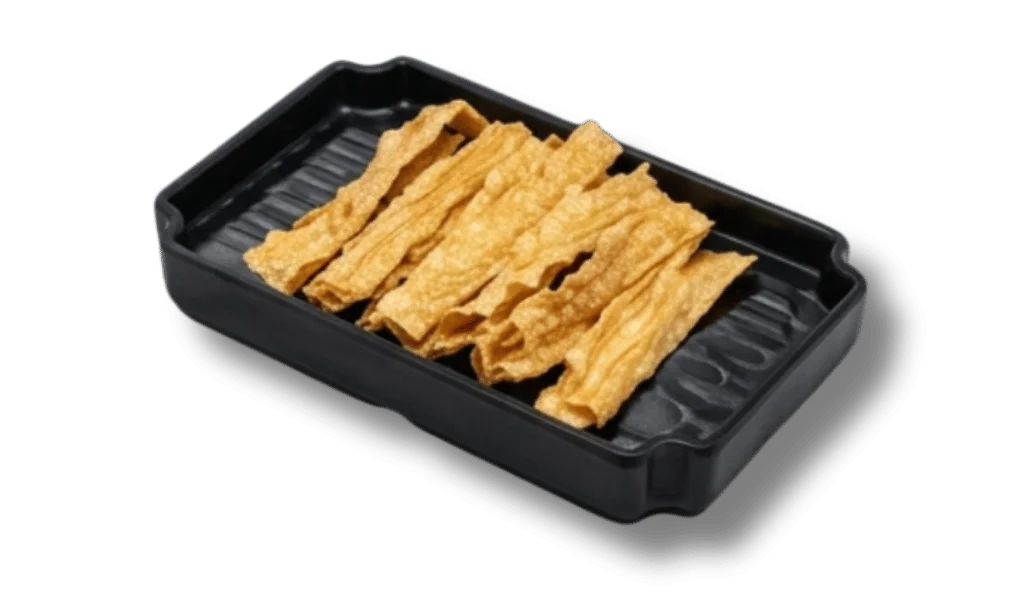 A black rectangular plate with crispy, golden fried strips.