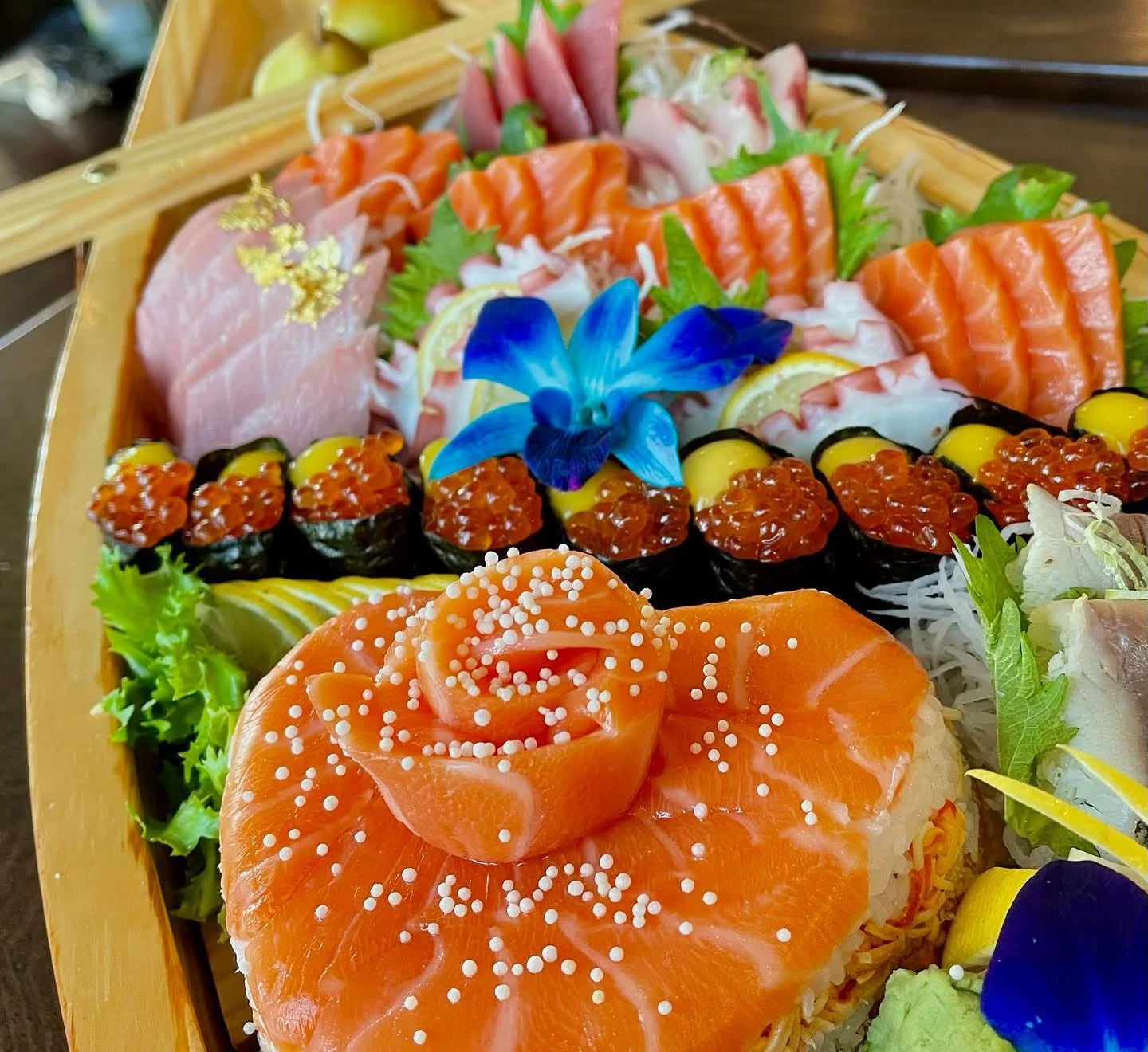 Artfully arranged Japanese sushi platter with sashimi and rolls