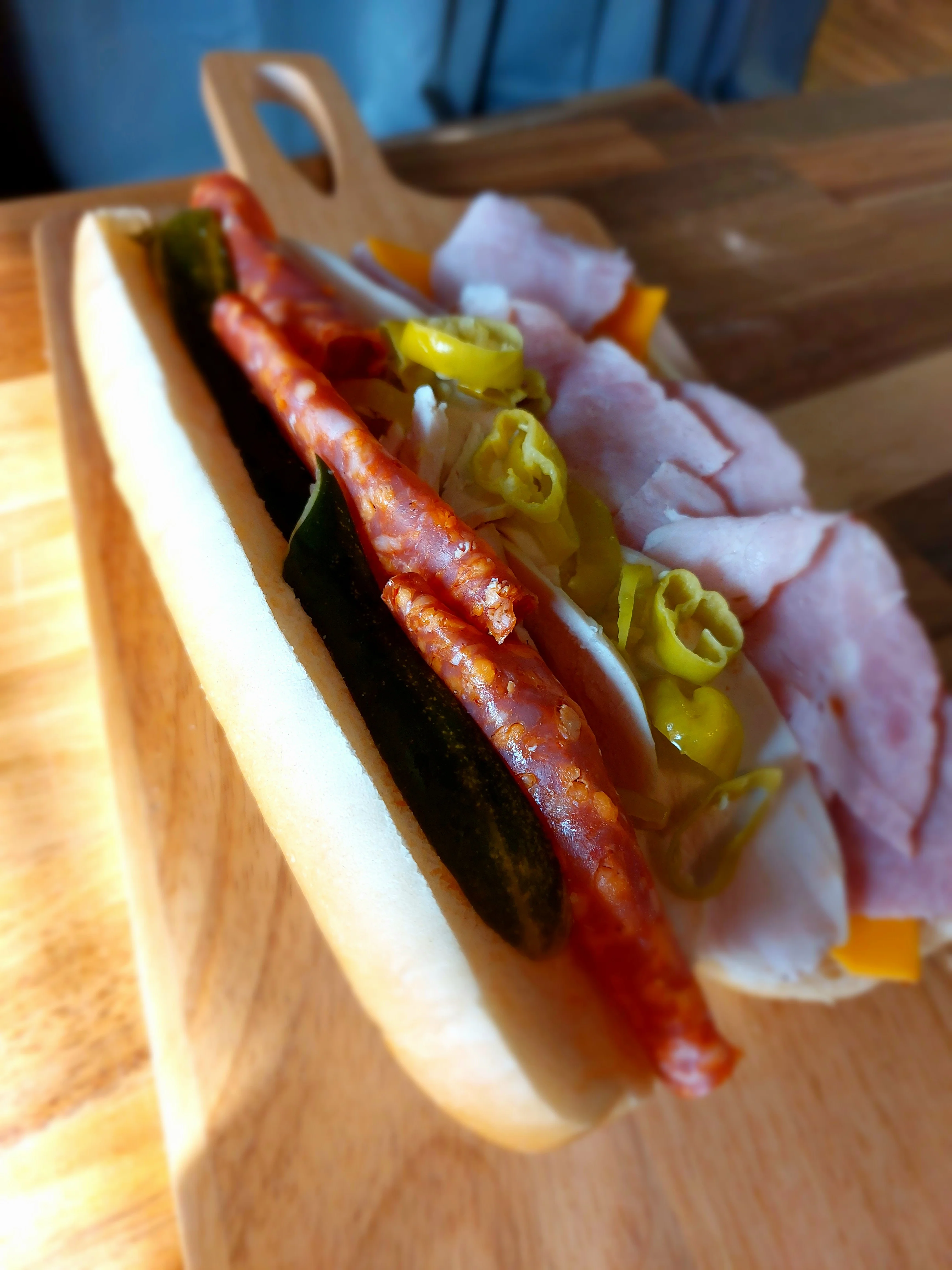 Italian sub sandwich with assorted meats and pickled vegetables