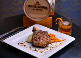 Grilled pork chop with whiskey cocktail