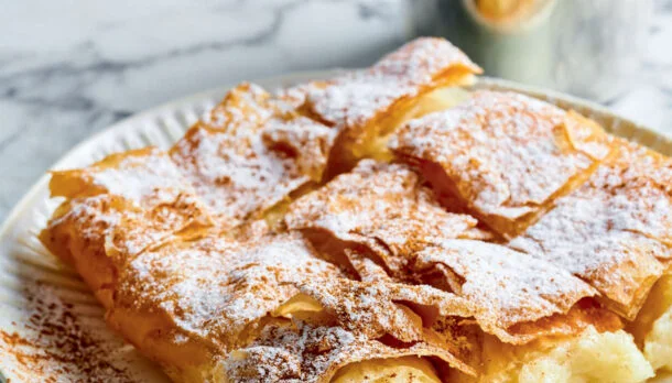 Delicious Serbian krempita dessert with powdered sugar