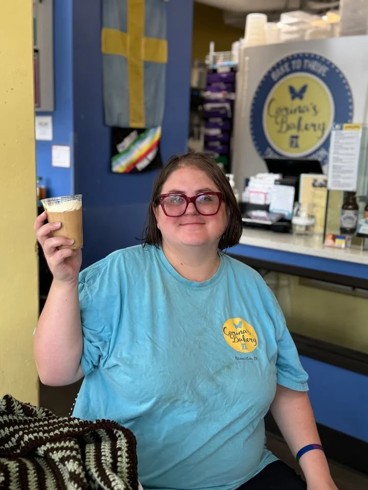 Customer enjoying a coffee at a cozy bakery