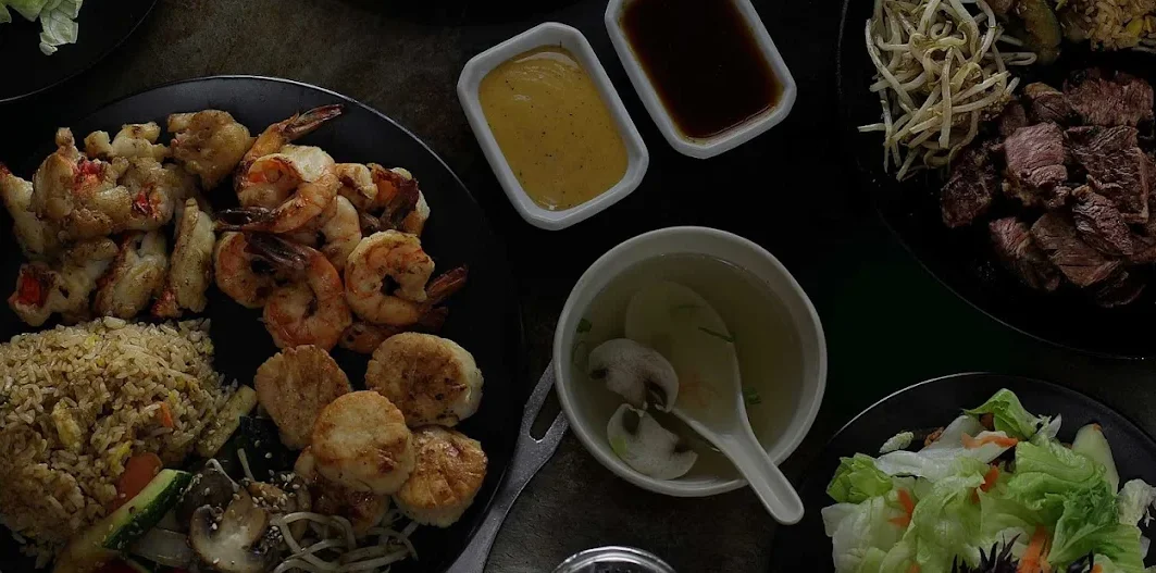 Assorted Asian stir-fry dishes with shrimp and vegetables