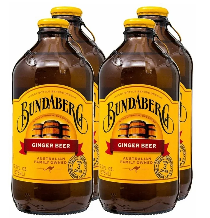 A pack of Bundaberg ginger beer bottles, showcasing their distinctive amber color and labels.
