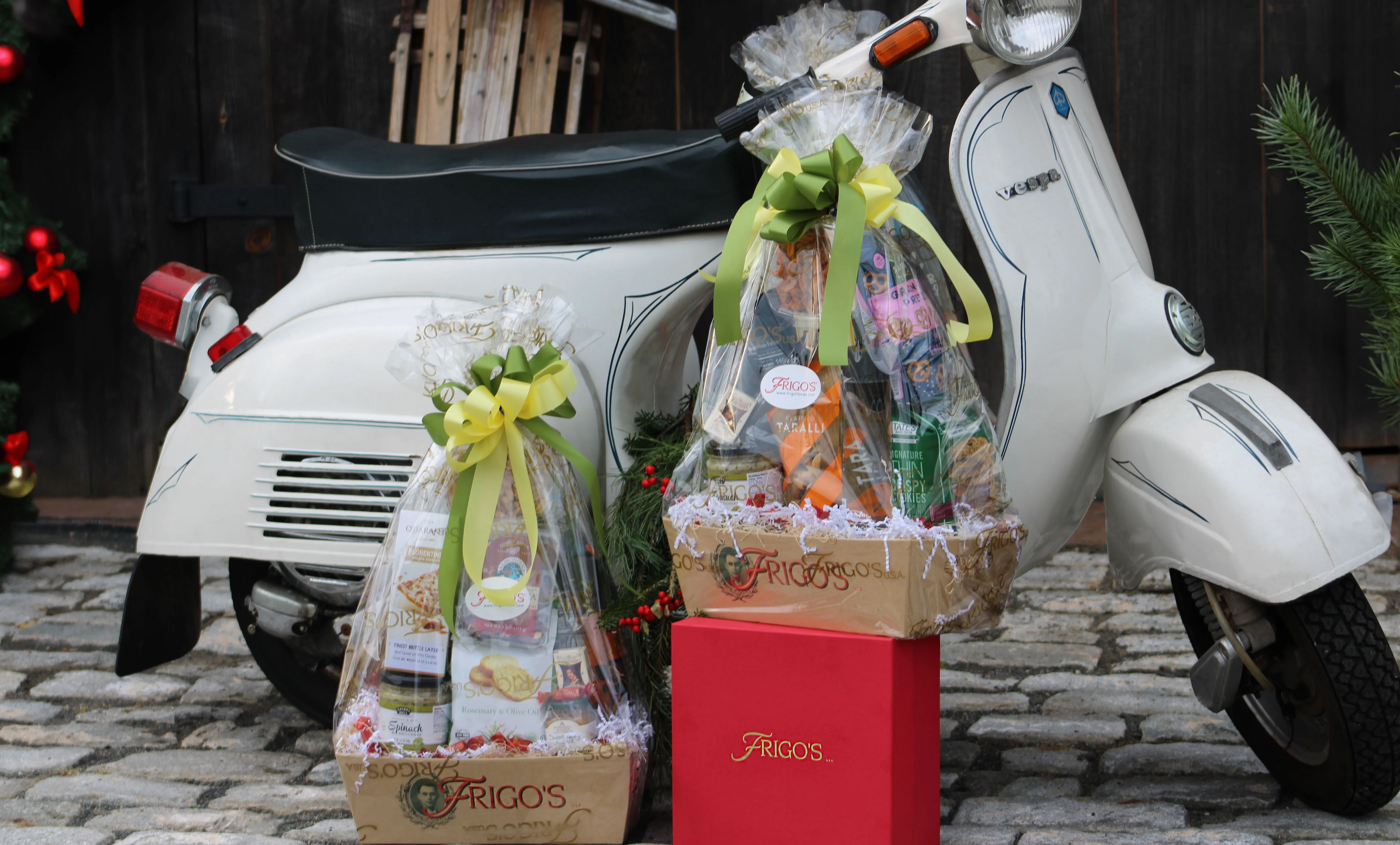 Festive holiday gift baskets beside a vintage scooter