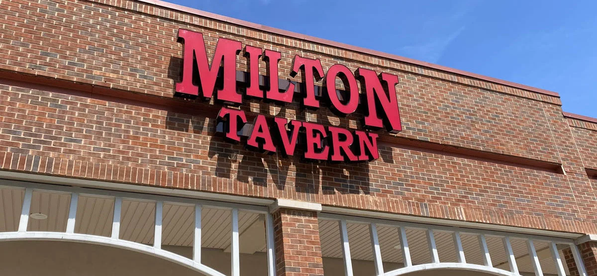 Restaurant exterior with bold signage against a blue sky