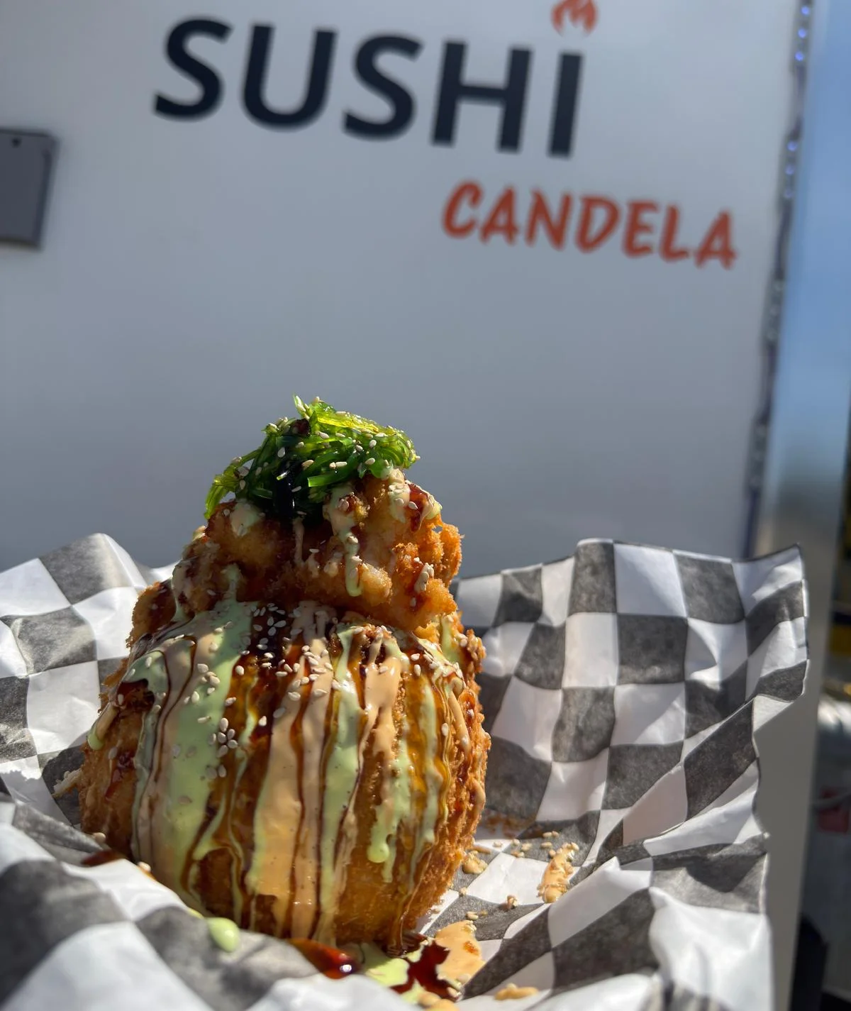 Japanese sushi roll with chocolate drizzle and strawberries
