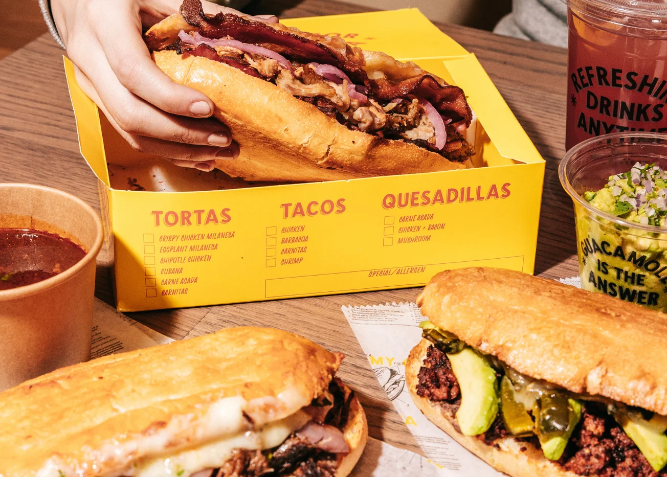 Delicious Mexican tortas served in a vibrant restaurant setting