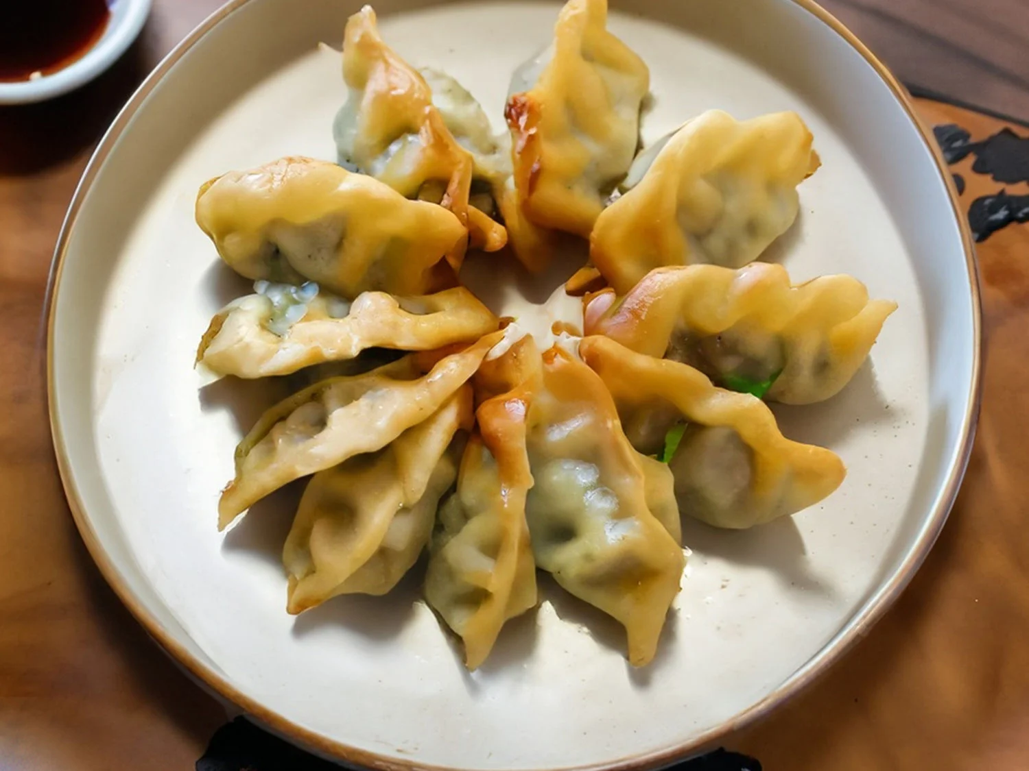 Plate of Chinese dumplings arranged in a circular pattern
