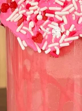 Strawberry milkshake with whipped cream and sprinkles