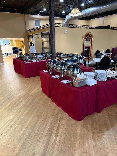 Elegant buffet setup with chafing dishes in a spacious dining area