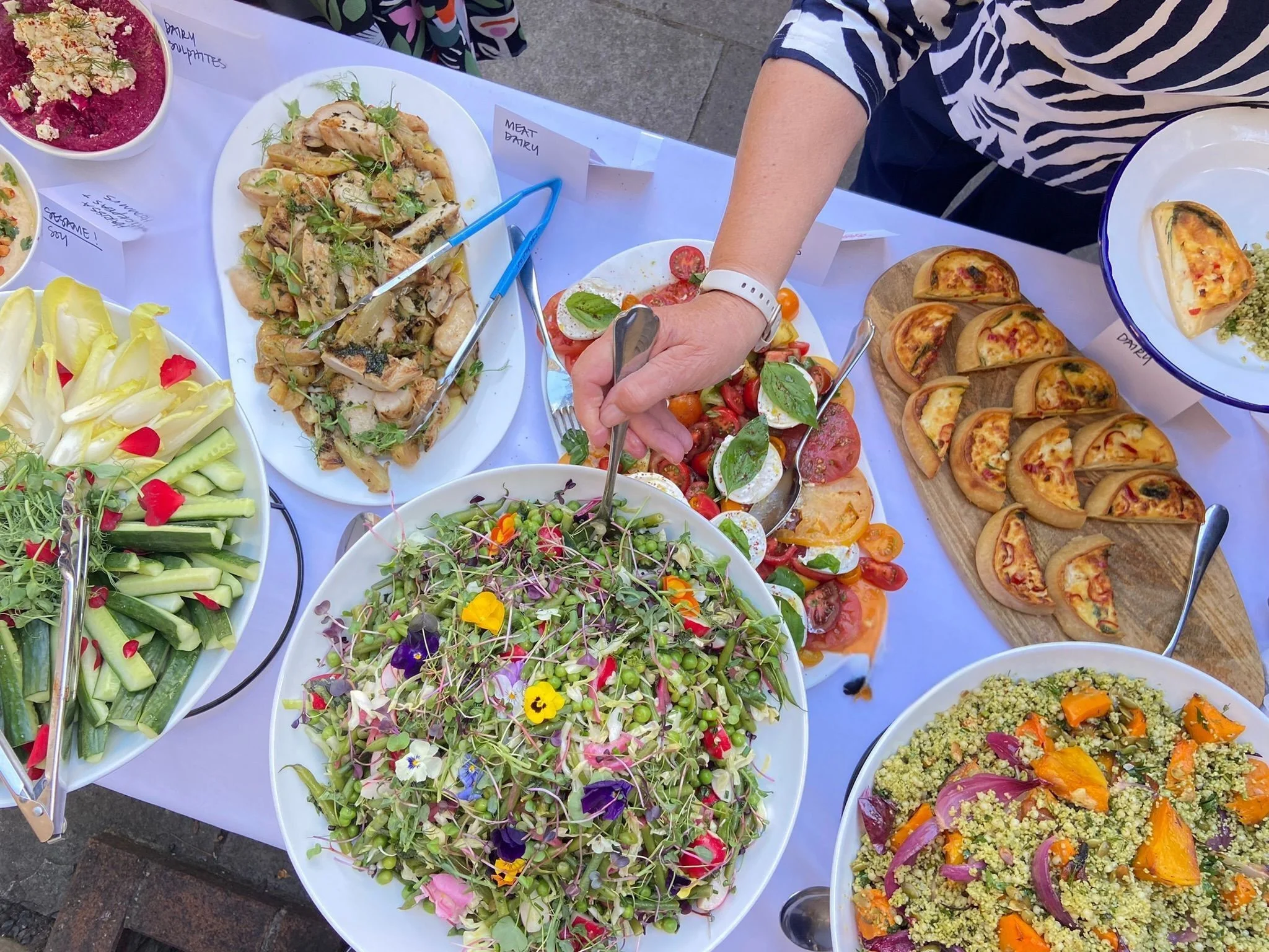 Colorful Mediterranean mezze platter with fresh salads and appetizers
