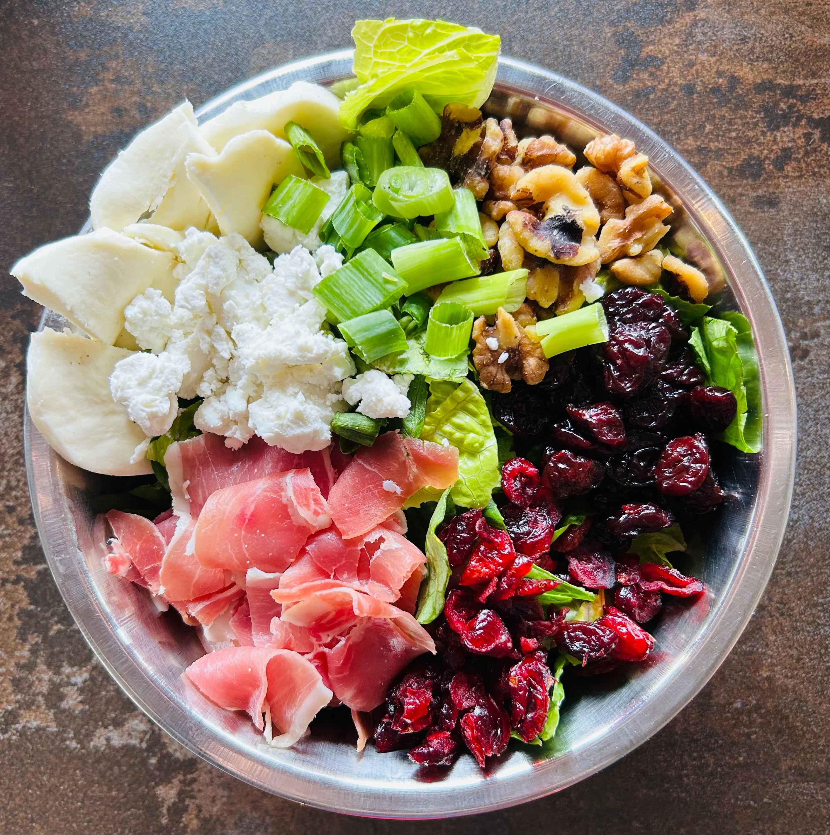 Fresh Italian antipasto salad with prosciutto and mixed greens