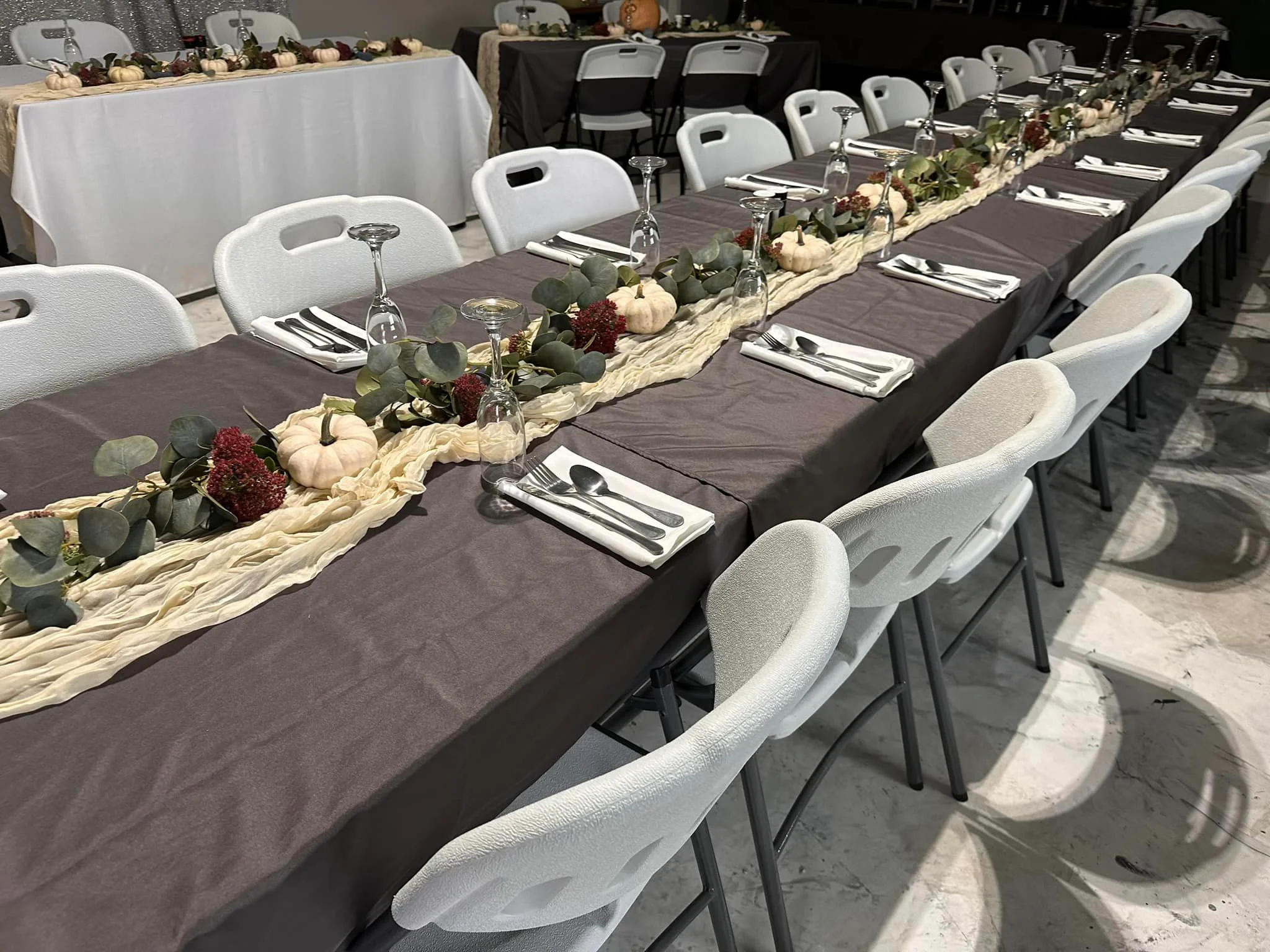 Elegant dining setup with rustic decor and table arrangements