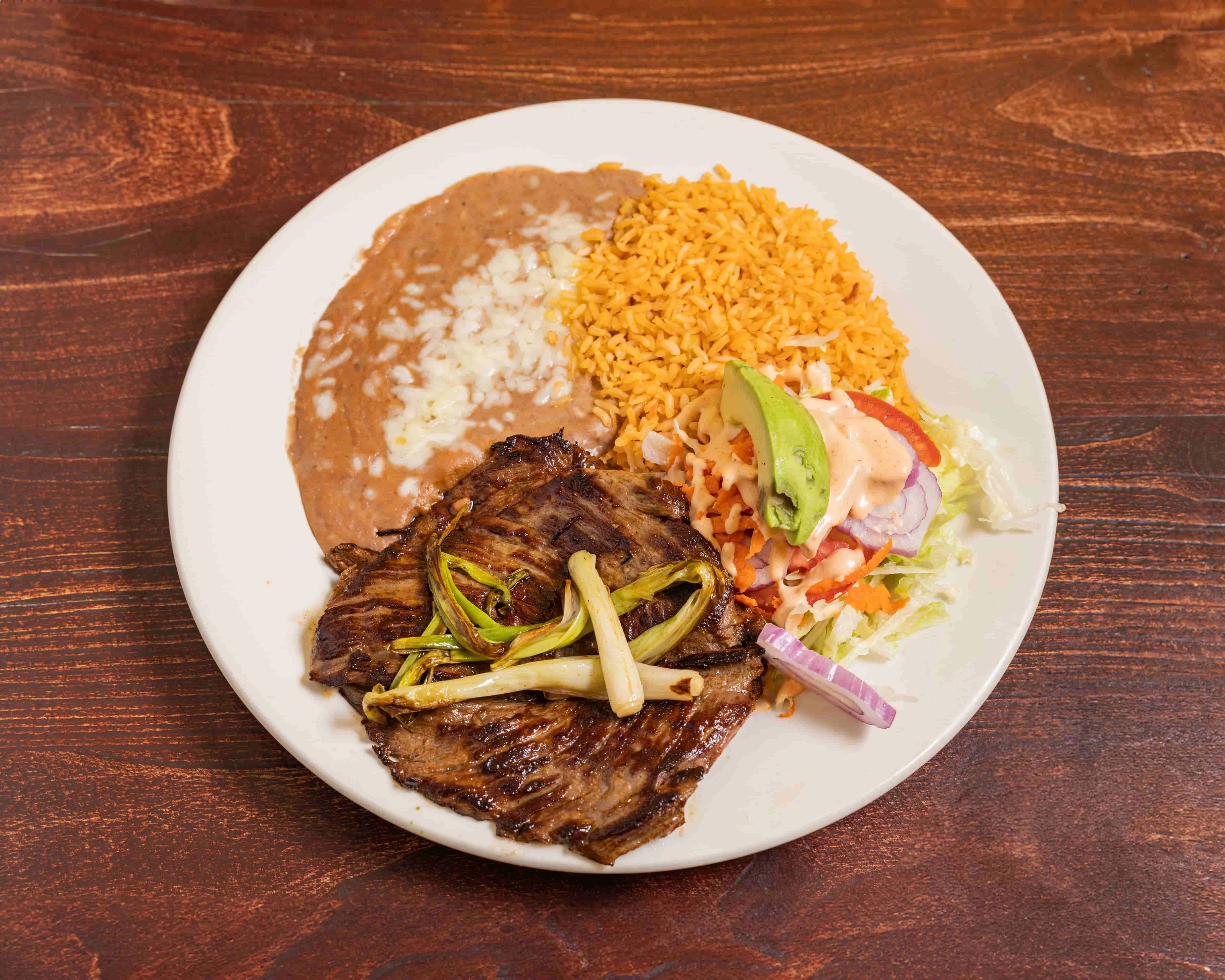 Grilled carne asada plate with rice and beans