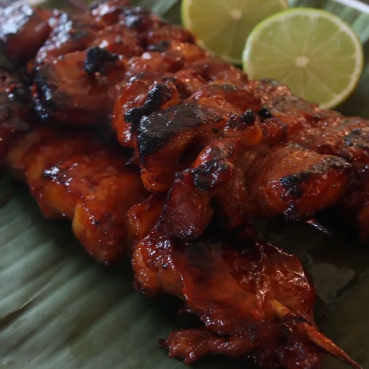 Filipino chicken inasal skewers with lime