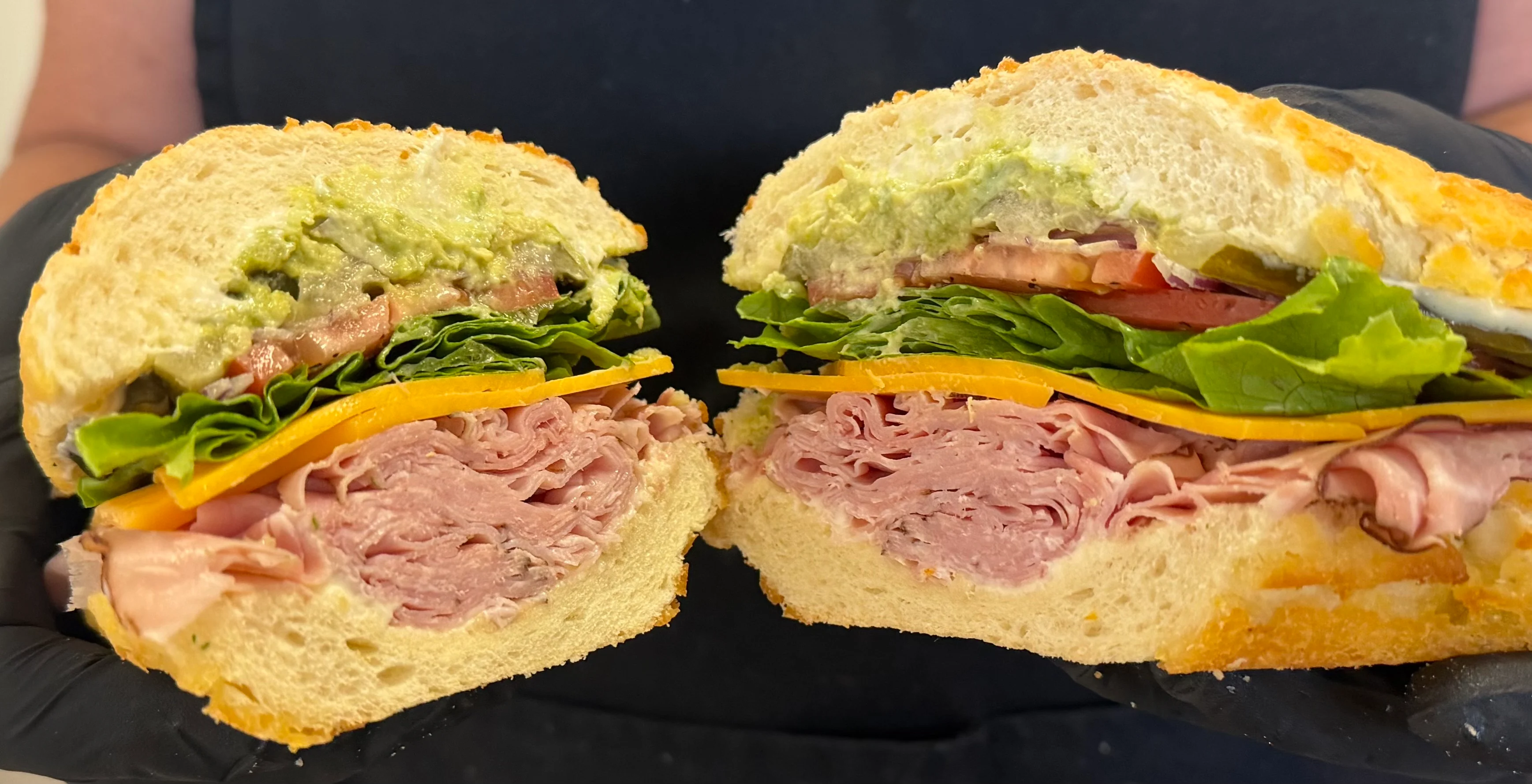 Classic deli sandwich with layers of meats and fresh vegetables