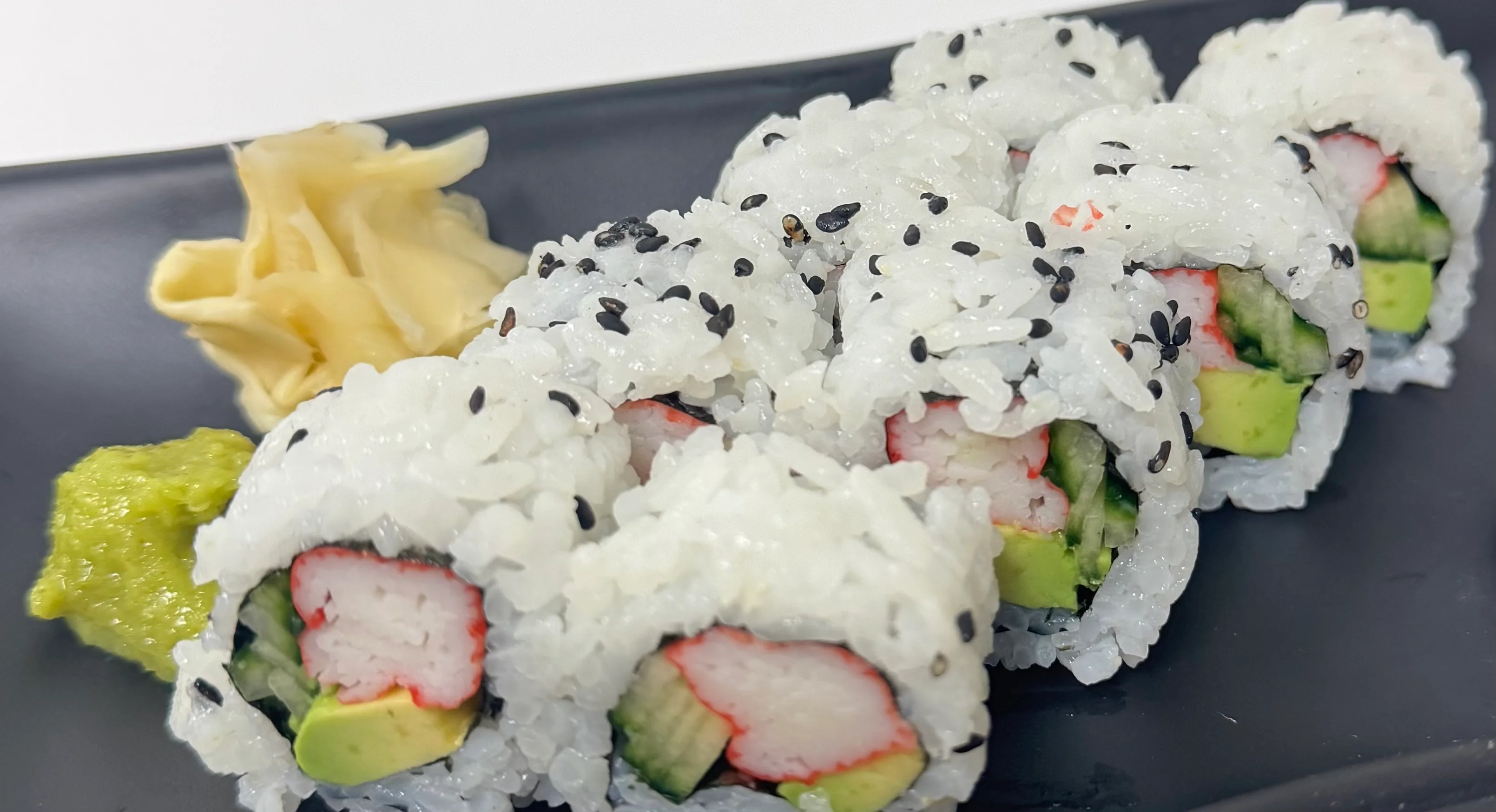 Japanese sushi rolls with crab and avocado